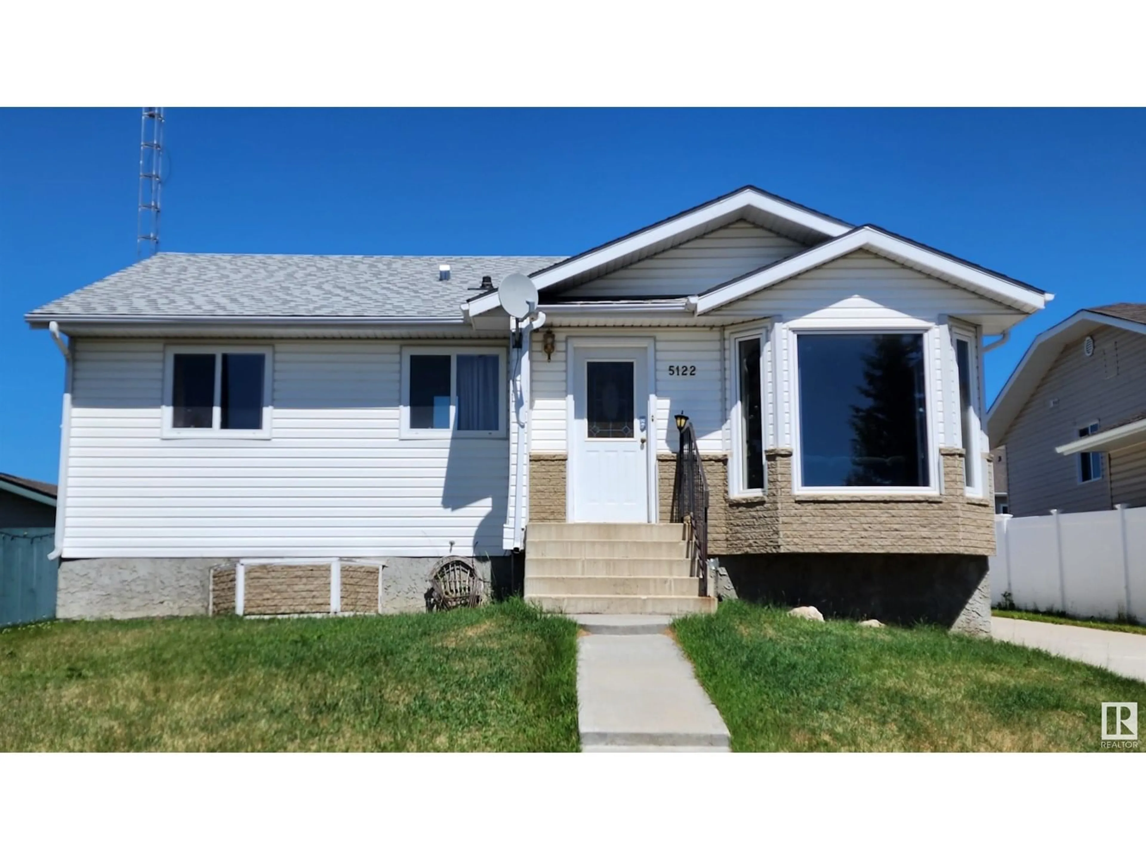 Home with vinyl exterior material, street for 5122 59 AV, Elk Point Alberta T0A1A0