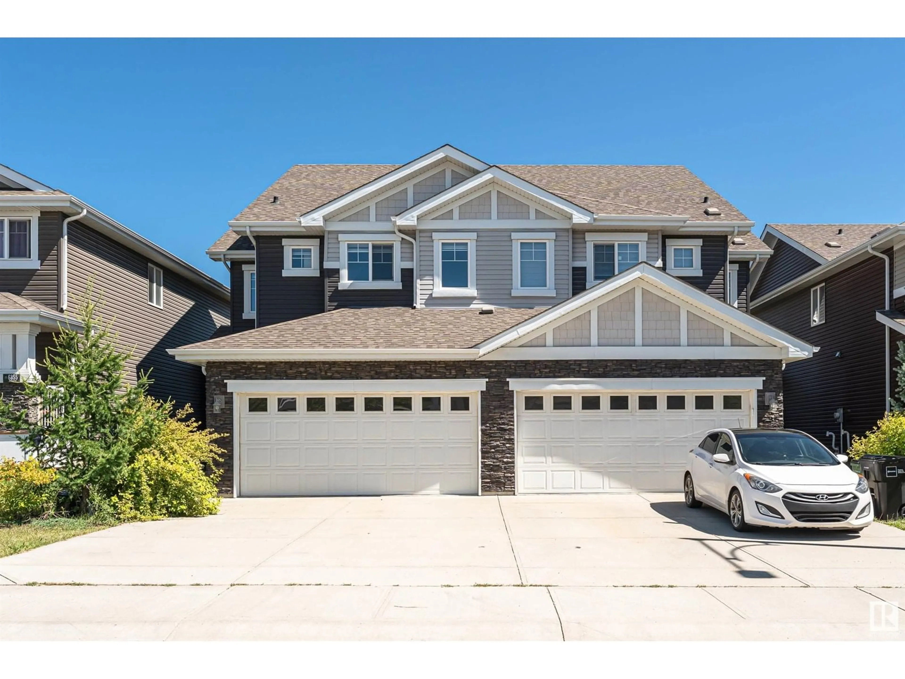 Home with vinyl exterior material, street for 6853 EVANS WD, Edmonton Alberta T6M0T6