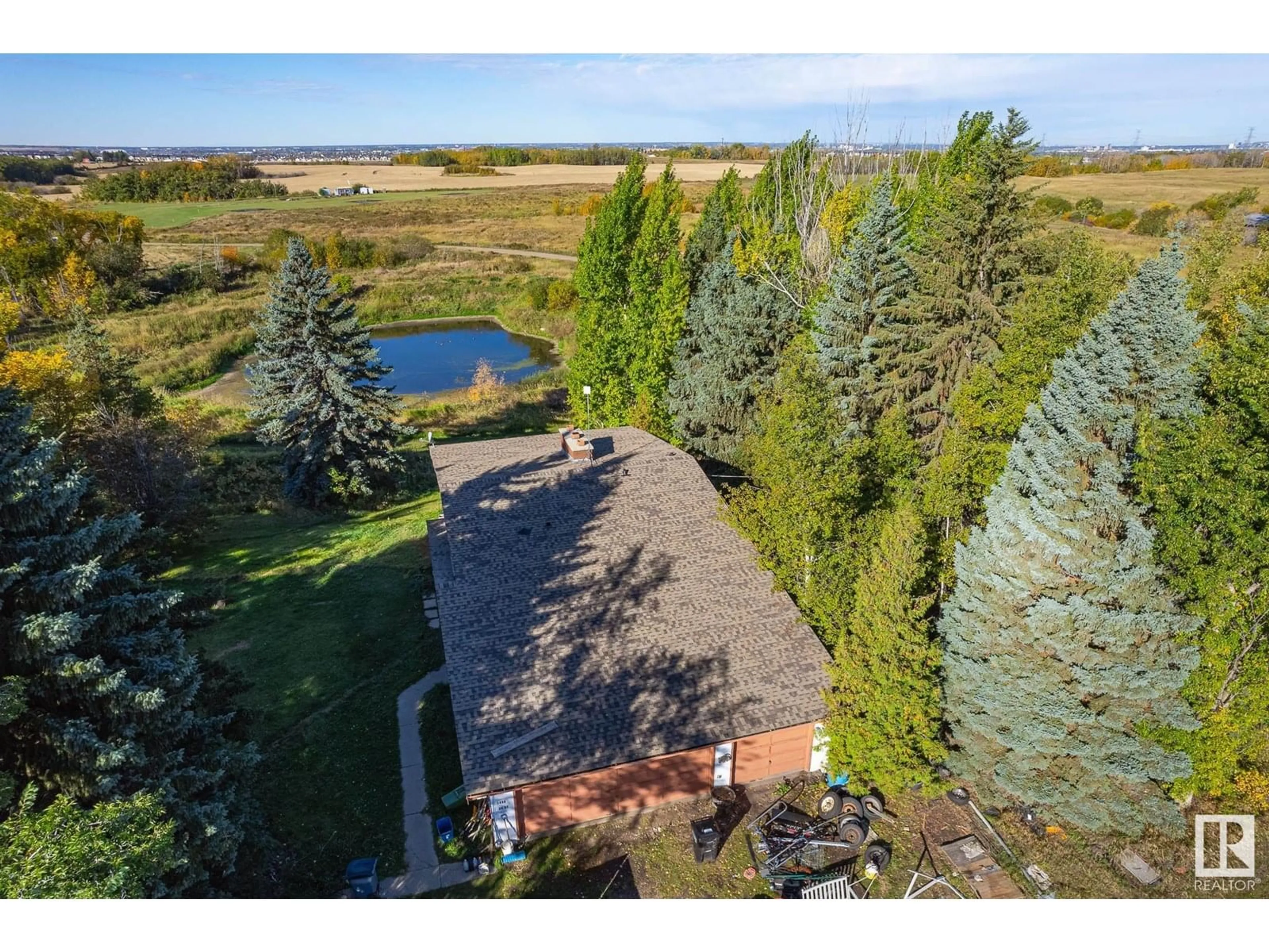 A pic from outside/outdoor area/front of a property/back of a property/a pic from drone, water/lake/river/ocean view for 1450 34 ST, Edmonton Alberta T6X1A5