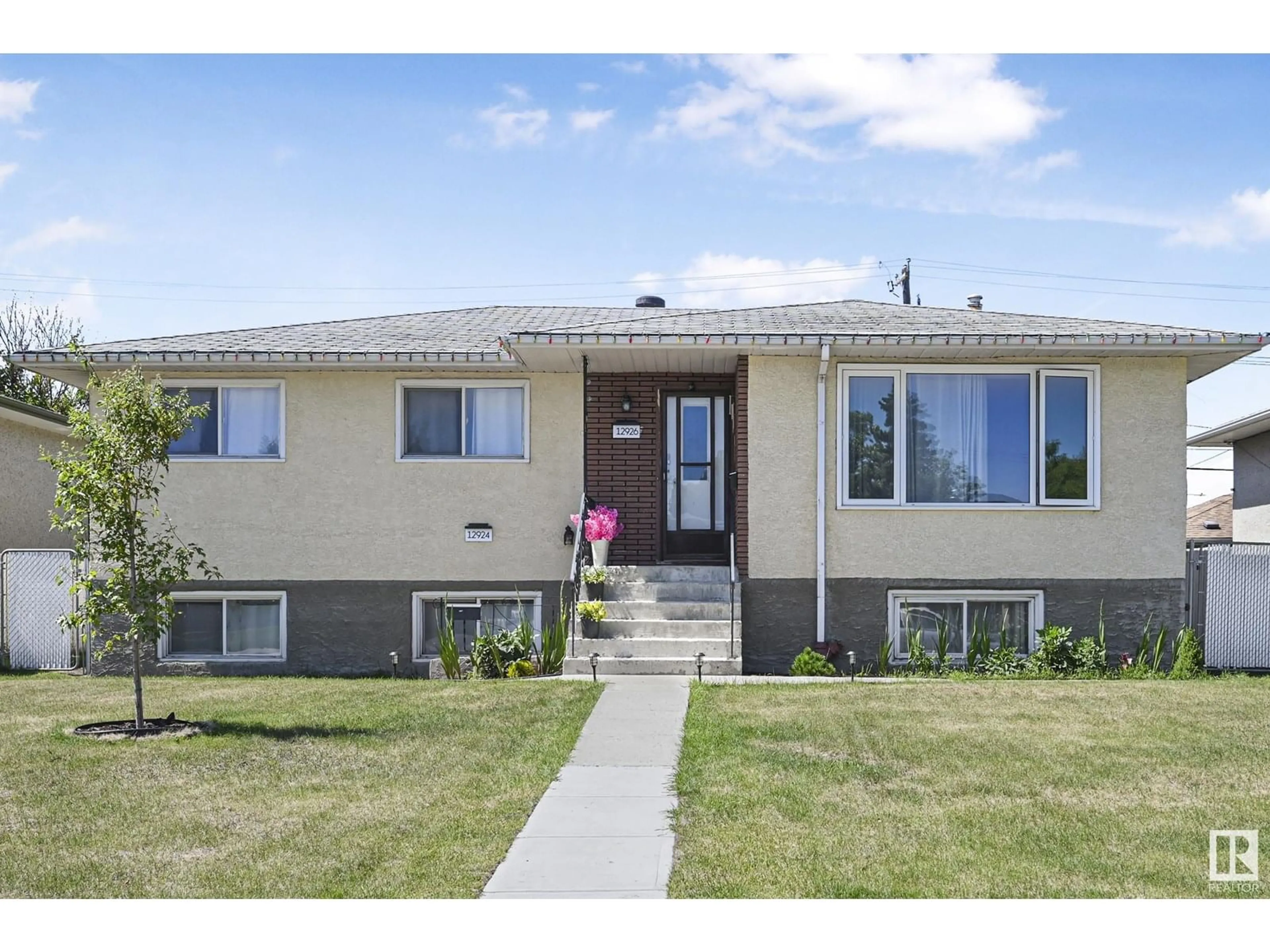 Home with vinyl exterior material, street for 12926 96 ST, Edmonton Alberta T5E4B1