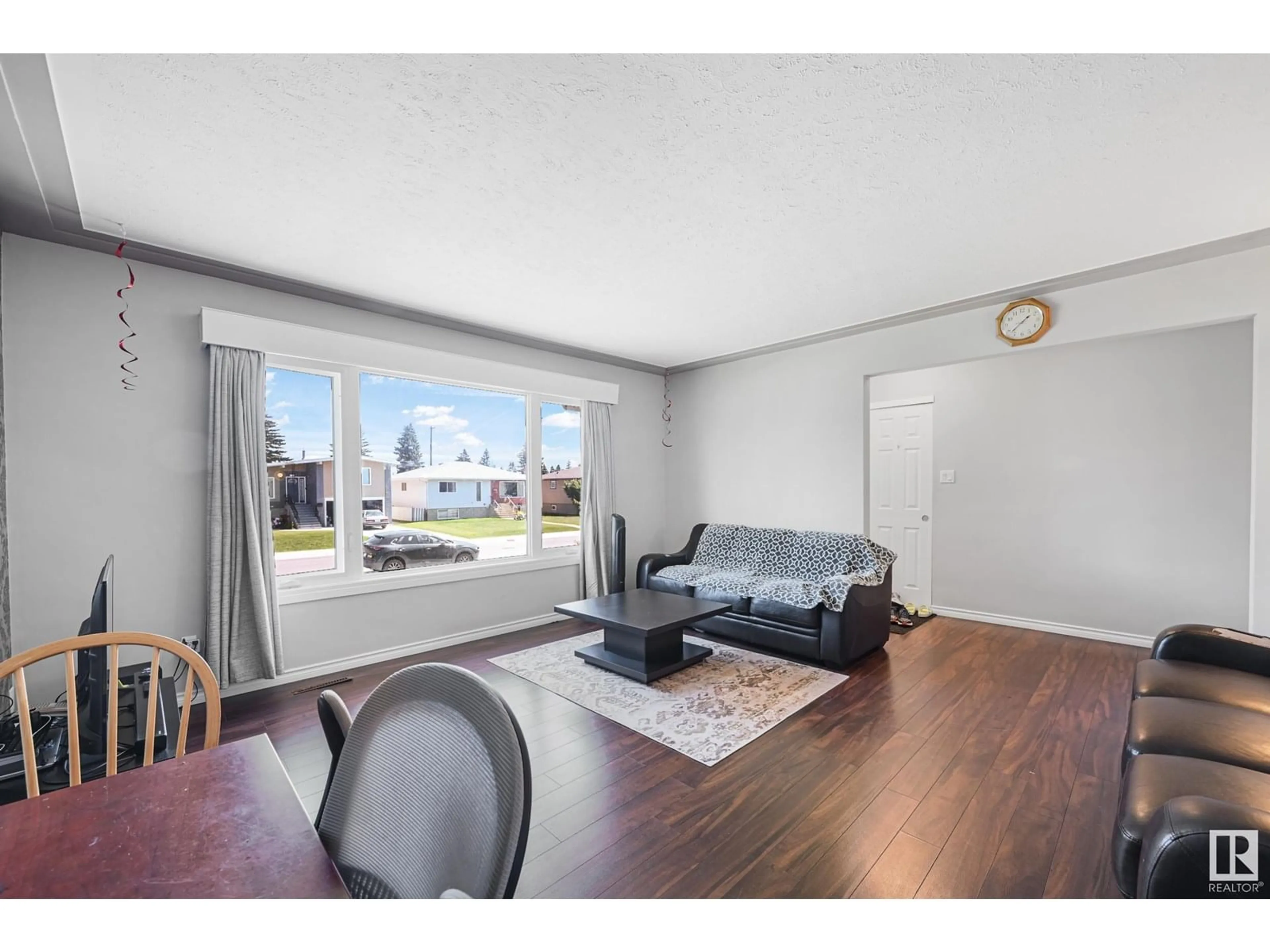 Living room with furniture, wood/laminate floor for 12926 96 ST, Edmonton Alberta T5E4B1