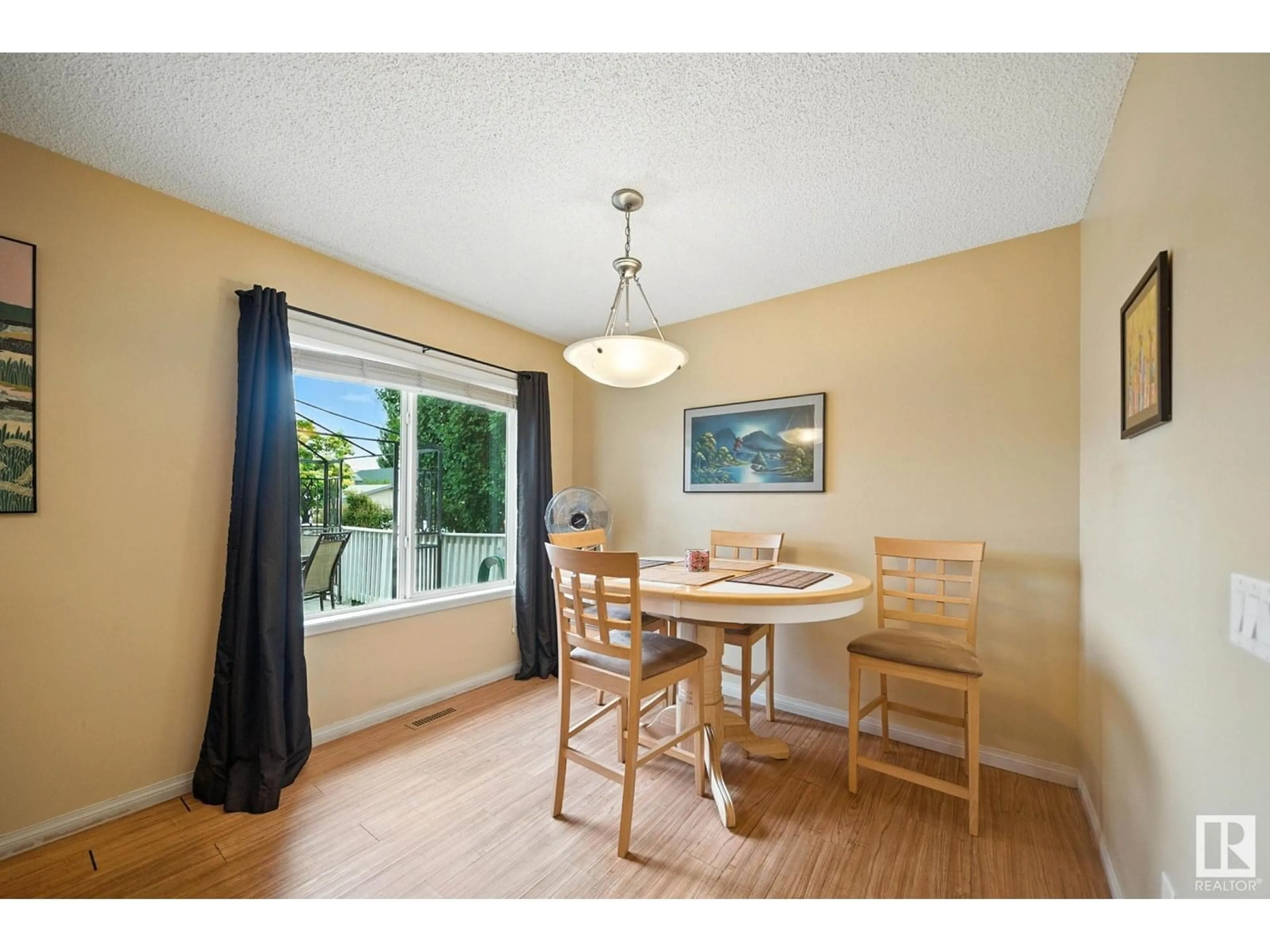 Dining room, wood/laminate floor for 4218 TERWILLEGAR VISTA VS, Edmonton Alberta T6R3E2