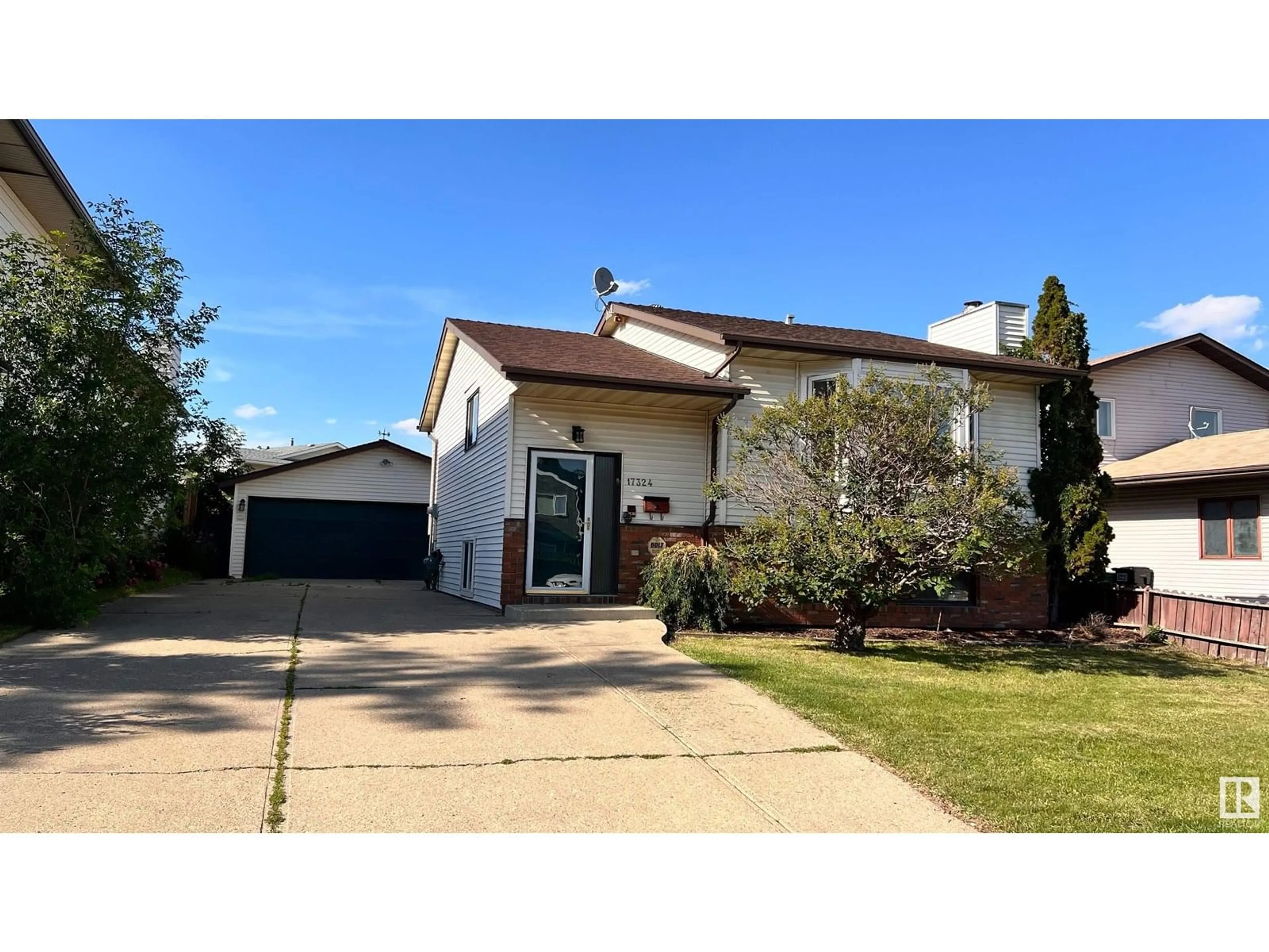 Home with vinyl exterior material, street for 17324 92 AV, Edmonton Alberta T5T3C2