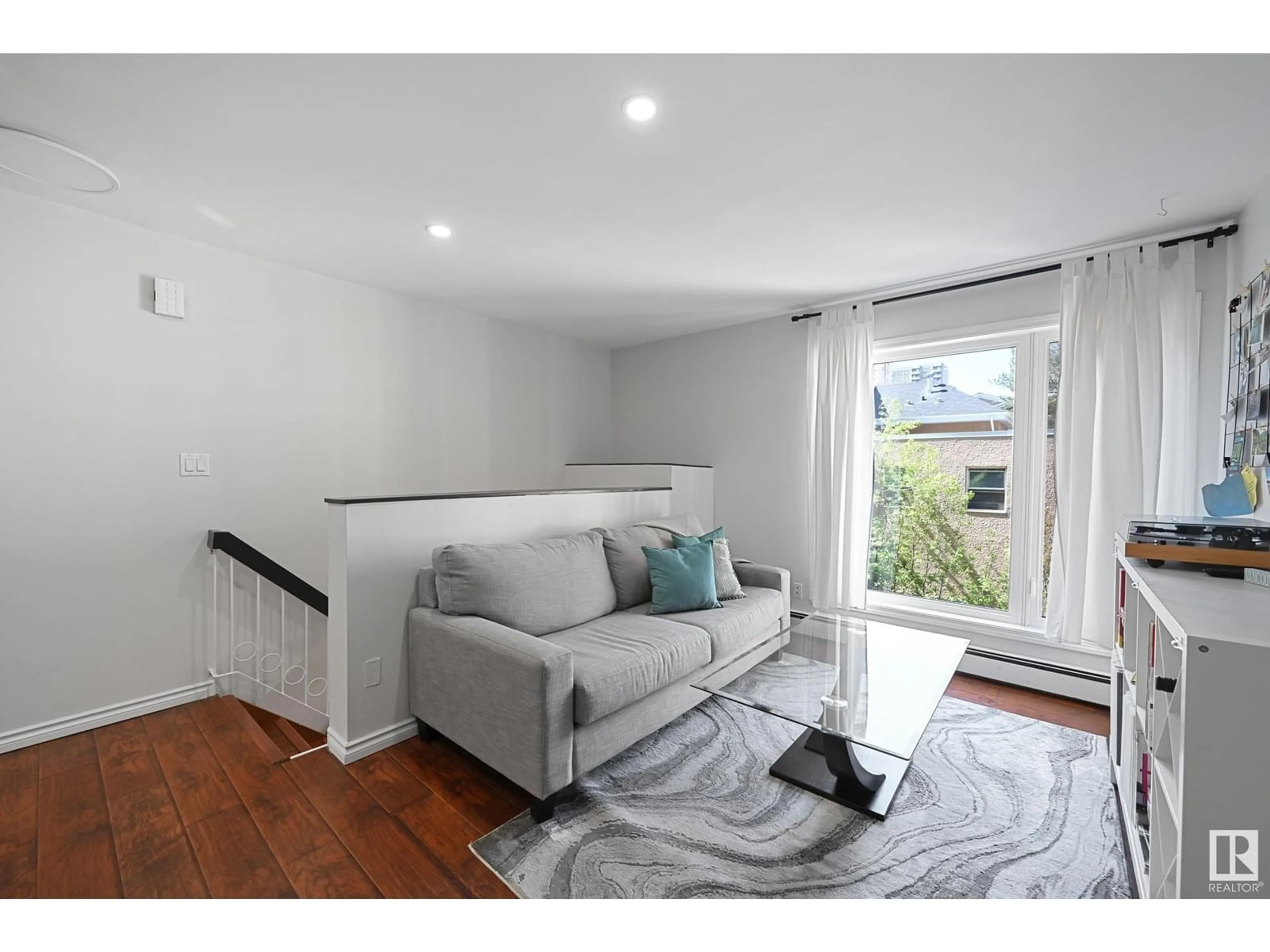 Living room with furniture, wood/laminate floor for #12 - 11016 86 AV, Edmonton Alberta T6G0W9