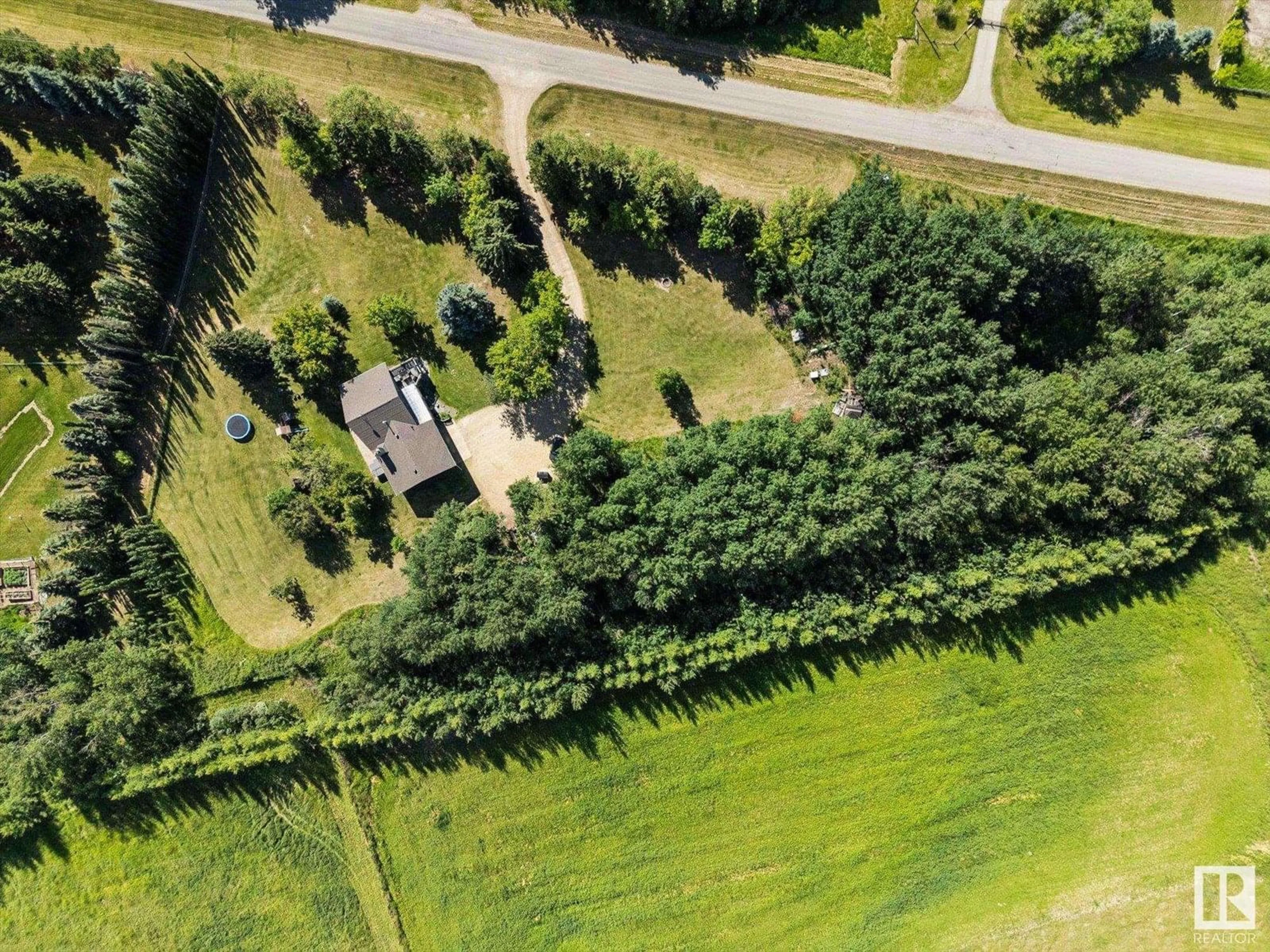 A pic from outside/outdoor area/front of a property/back of a property/a pic from drone, forest/trees view for #4 - 1017 TWP ROAD 540, Rural Parkland County Alberta T7Y0A6