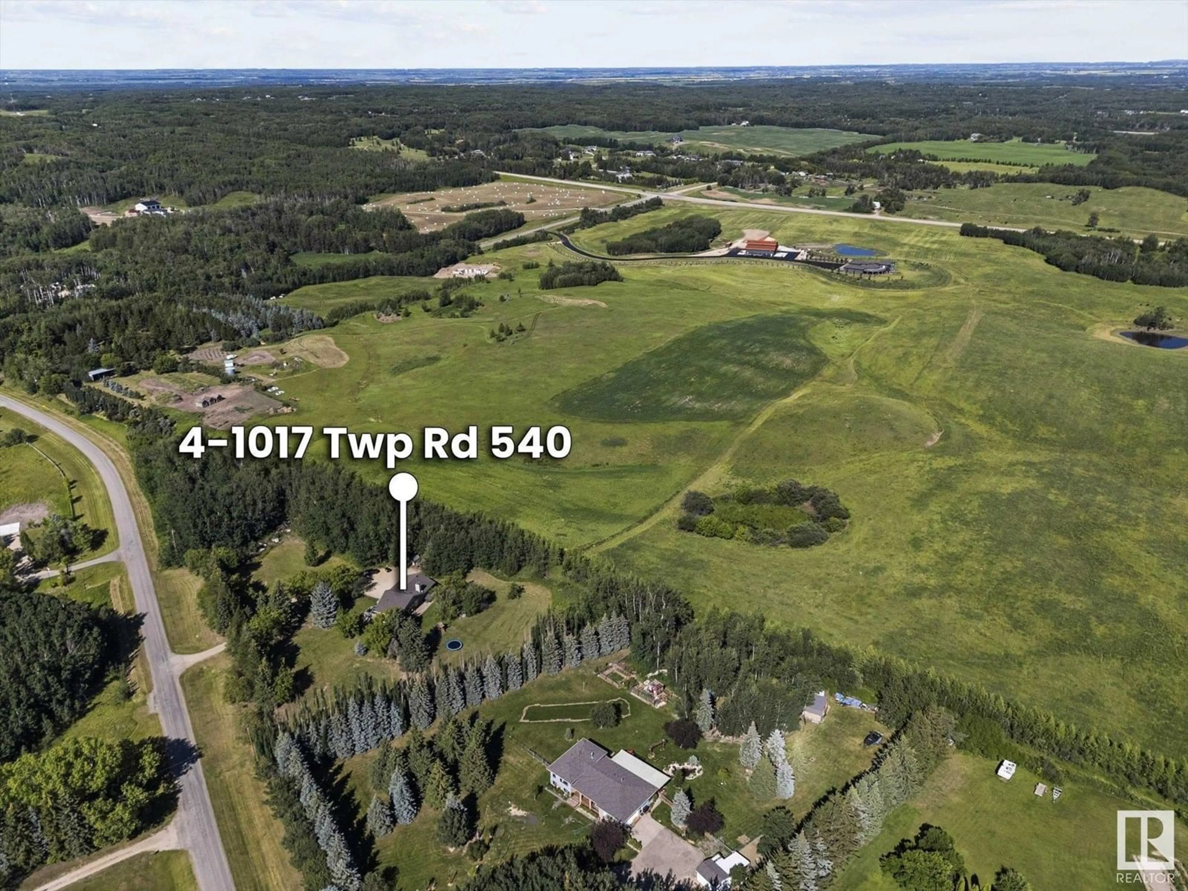 A pic from outside/outdoor area/front of a property/back of a property/a pic from drone, forest/trees view for #4 - 1017 TWP ROAD 540, Rural Parkland County Alberta T7Y0A6