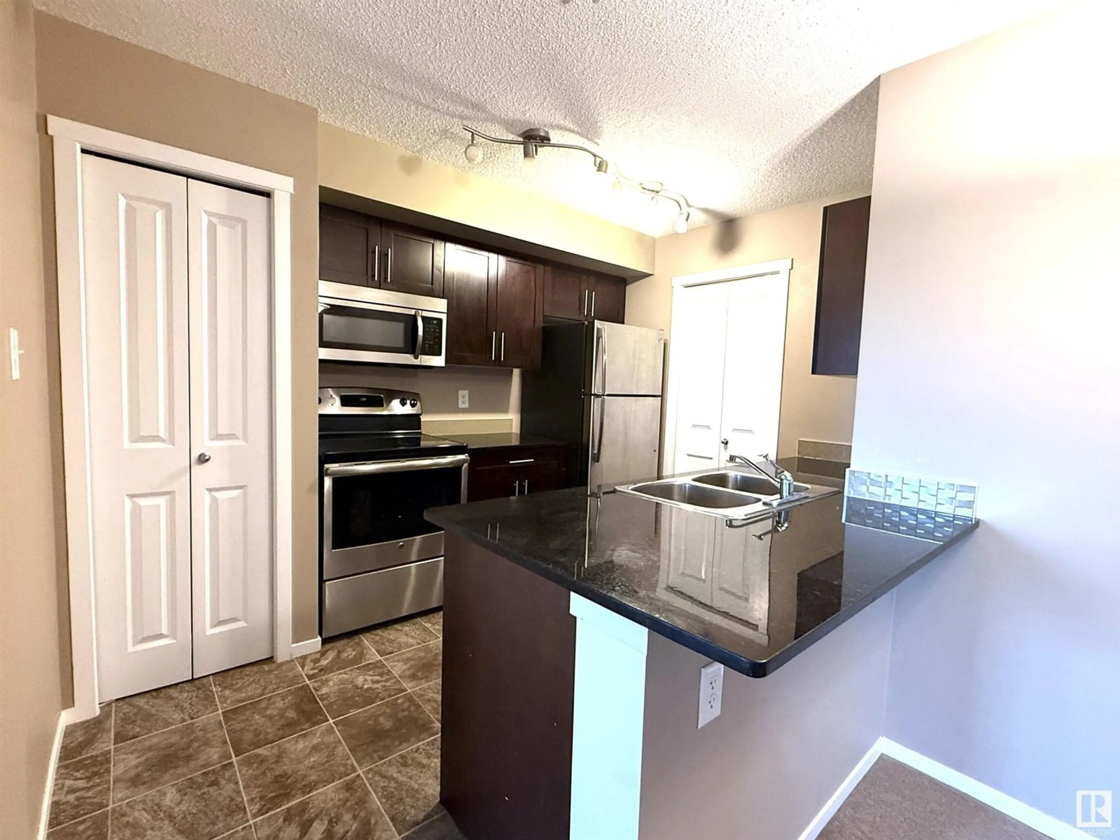 Open concept kitchen, unknown for #208 - 18126 77 ST, Edmonton Alberta T5Z0N7
