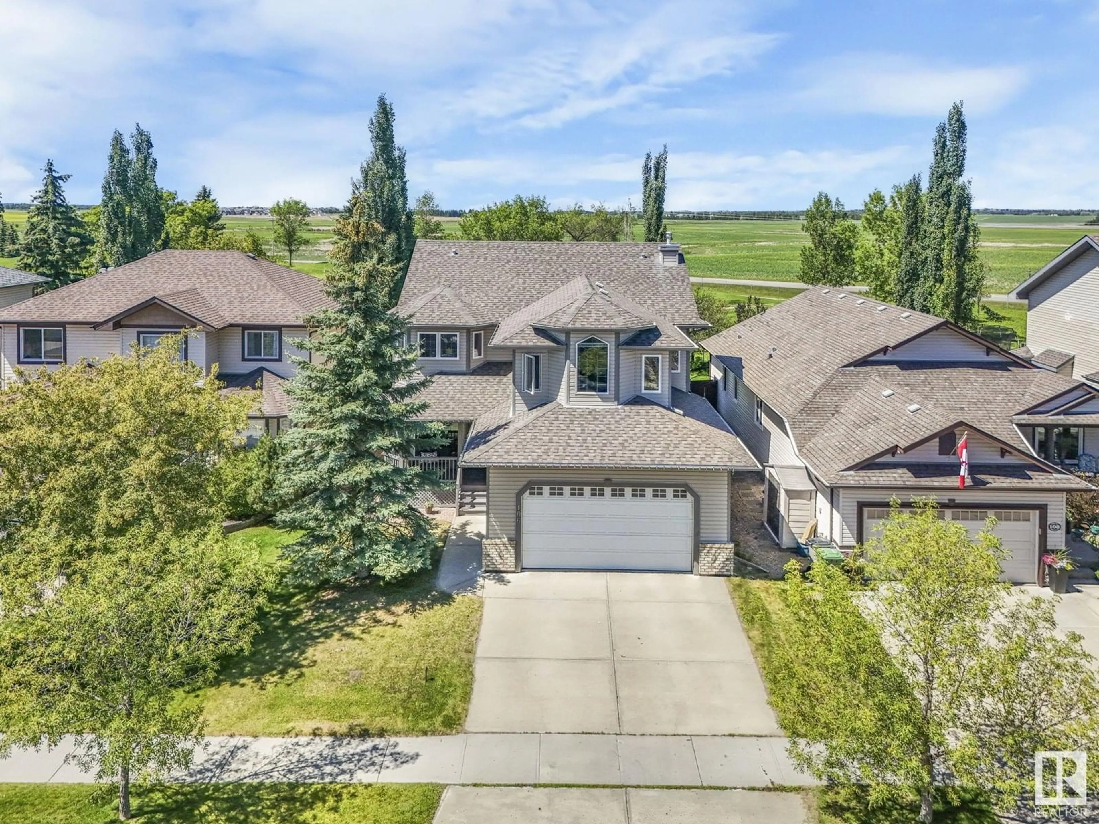 A pic from outside/outdoor area/front of a property/back of a property/a pic from drone, unknown for 106 RIDEAU CR, Beaumont Alberta T4X0B9