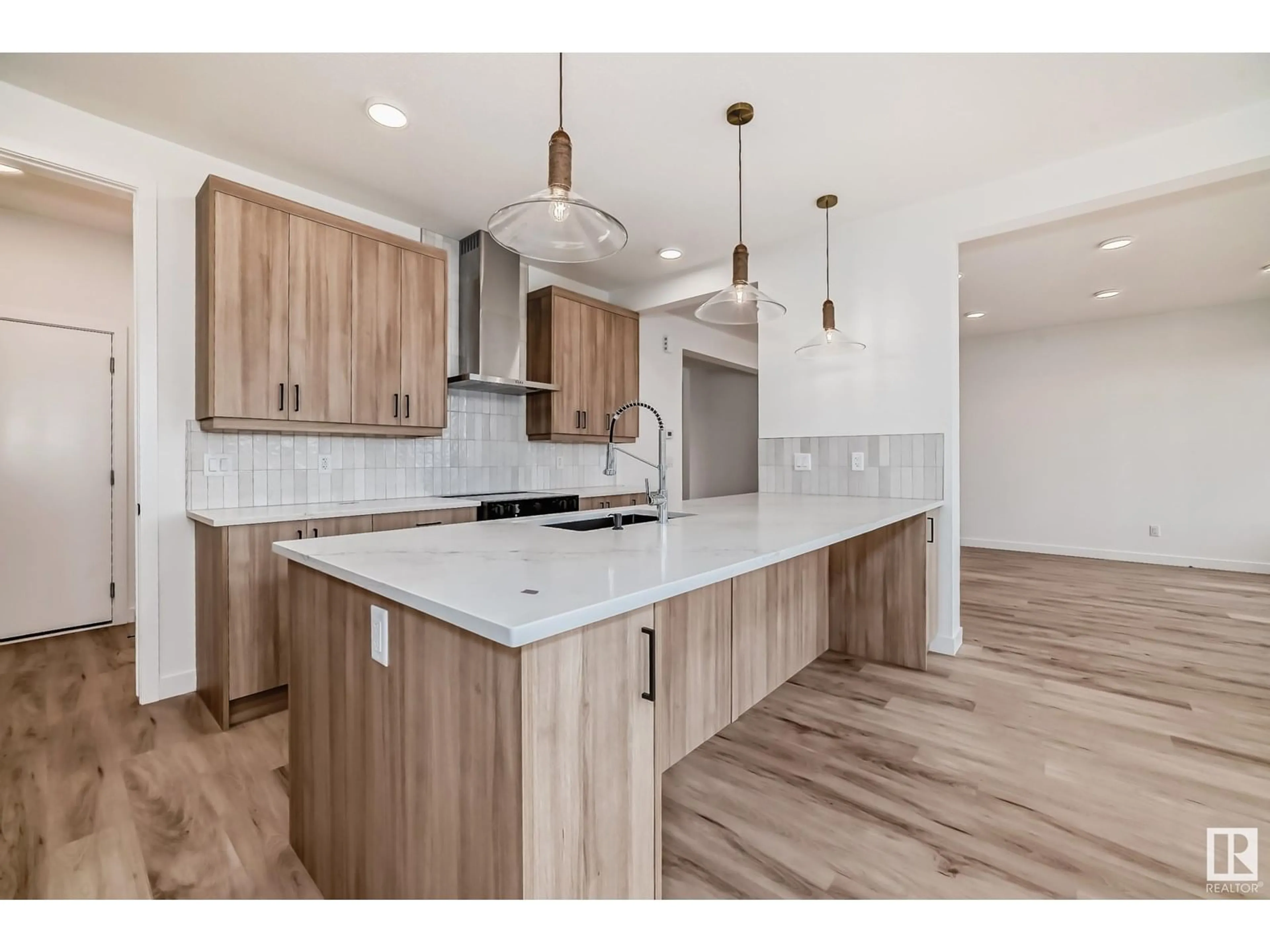 Open concept kitchen, wood/laminate floor for SW - 5828 KOOTOOK LI, Edmonton Alberta T6W4Z6
