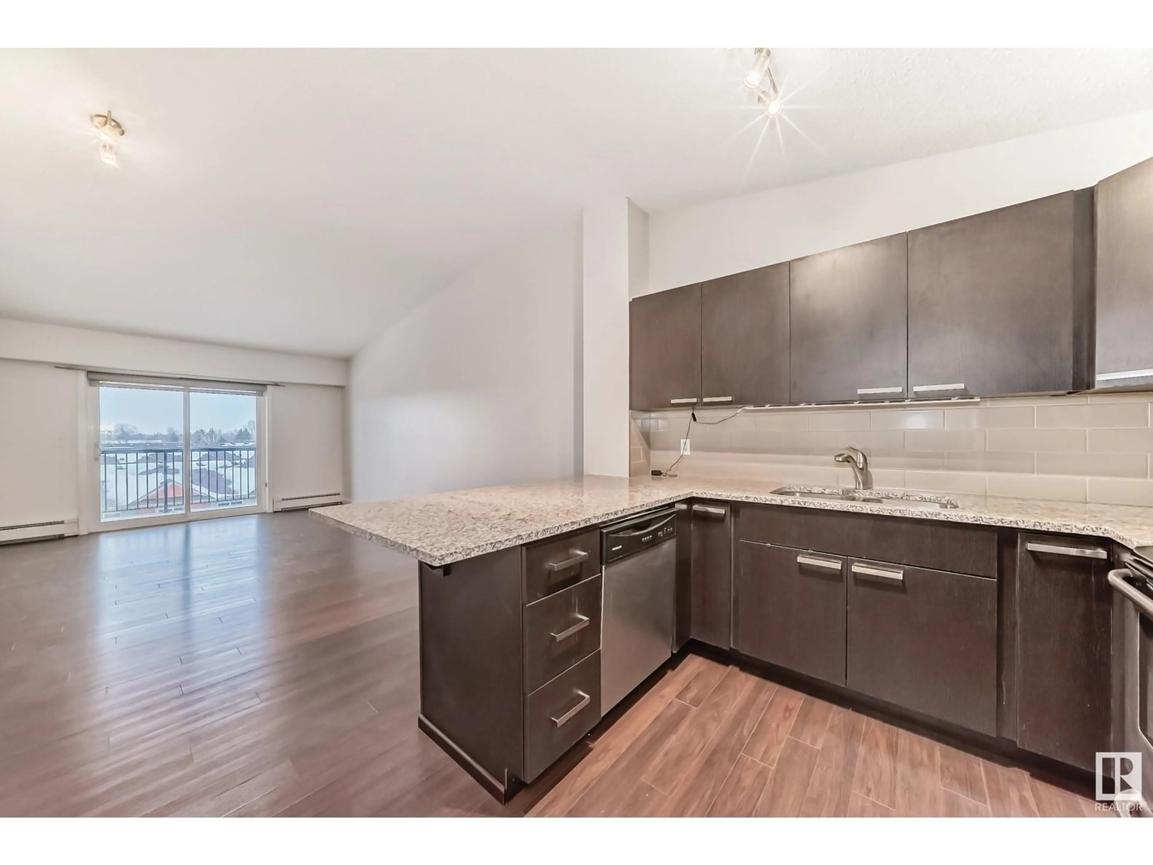 Open concept kitchen, wood/laminate floor for #406 - 14808 125 ST, Edmonton Alberta T5X0G1