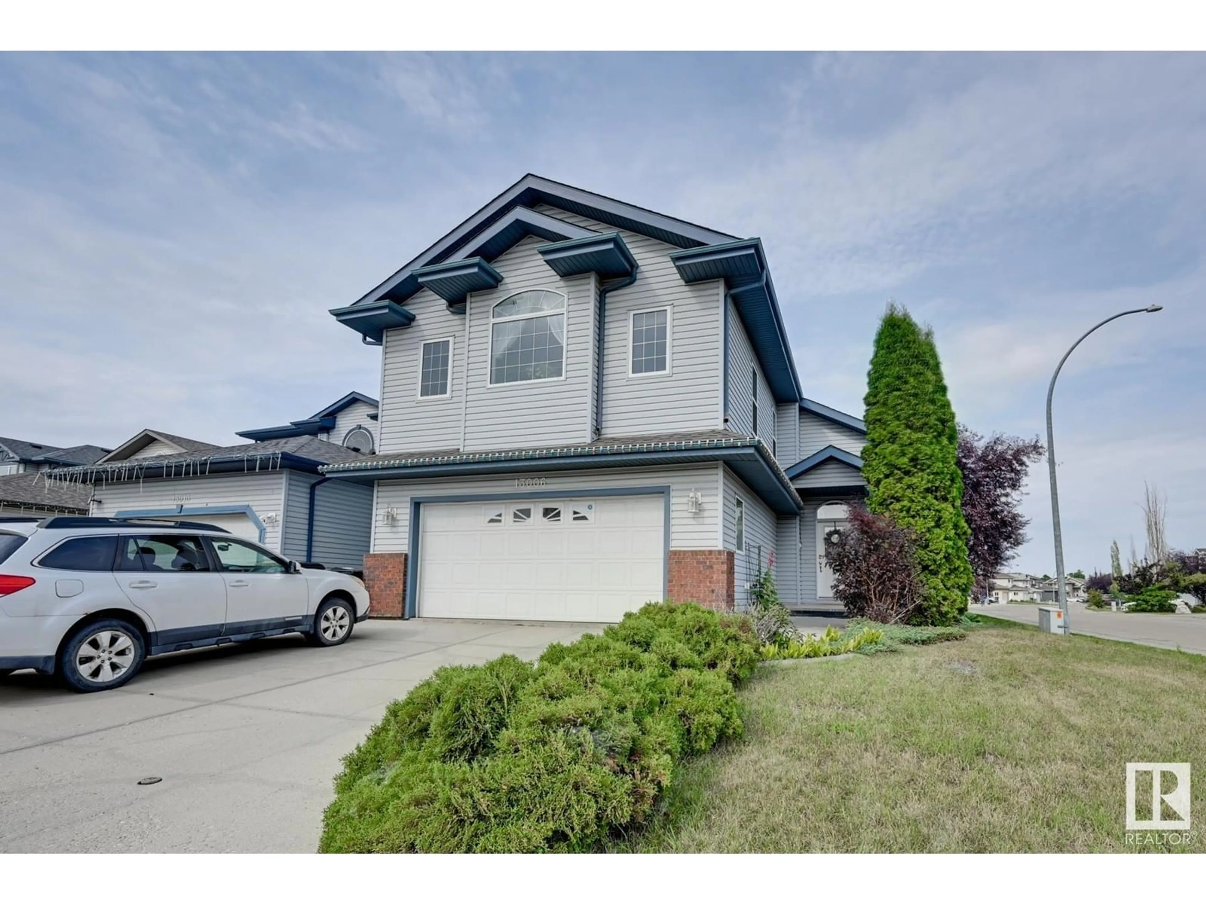 Home with vinyl exterior material, street for NW - 13006 141B AV, Edmonton Alberta T6V1P4