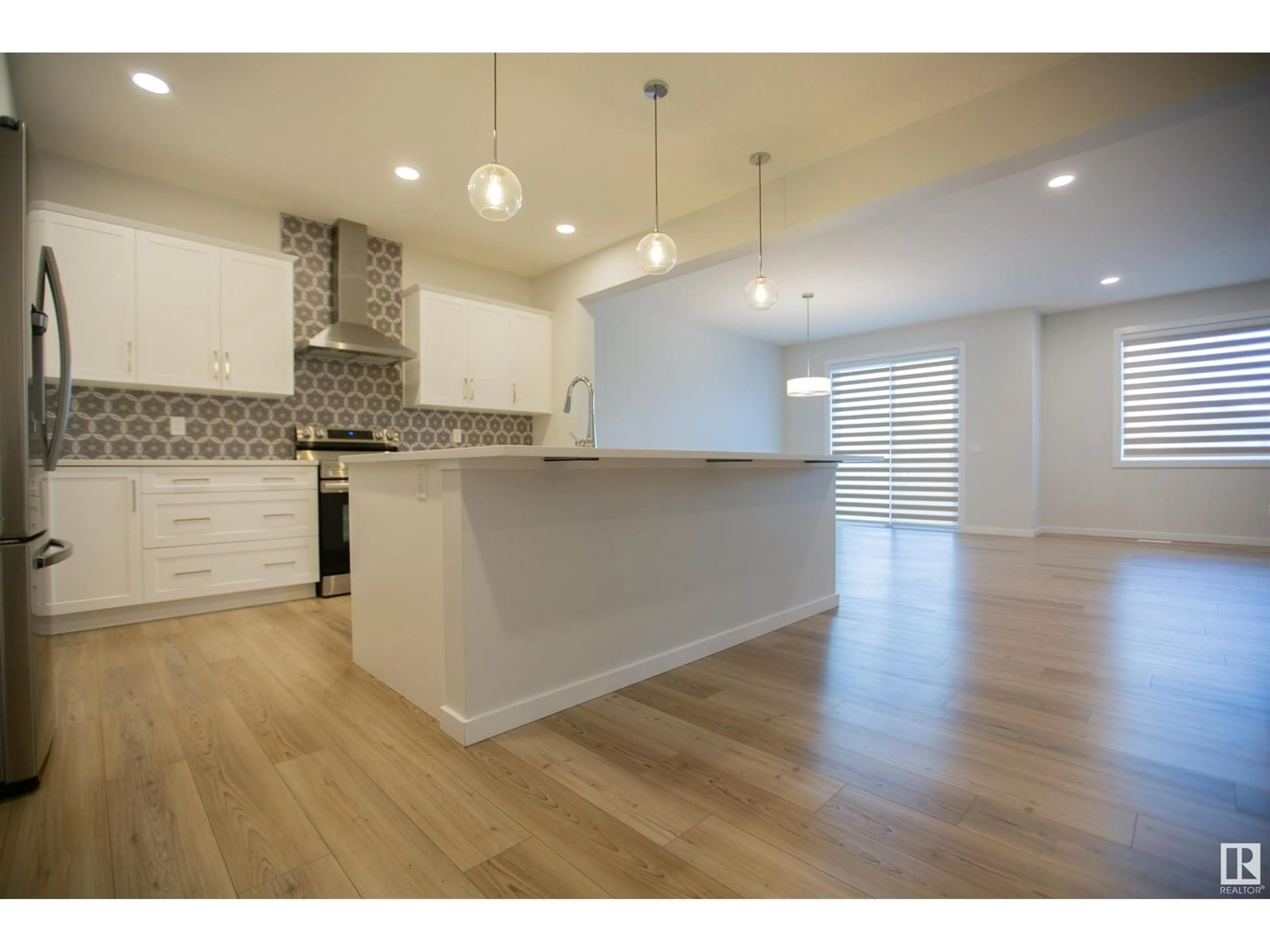 Open concept kitchen, wood/laminate floor for NW - 2815 200 ST, Edmonton Alberta T6M0W8