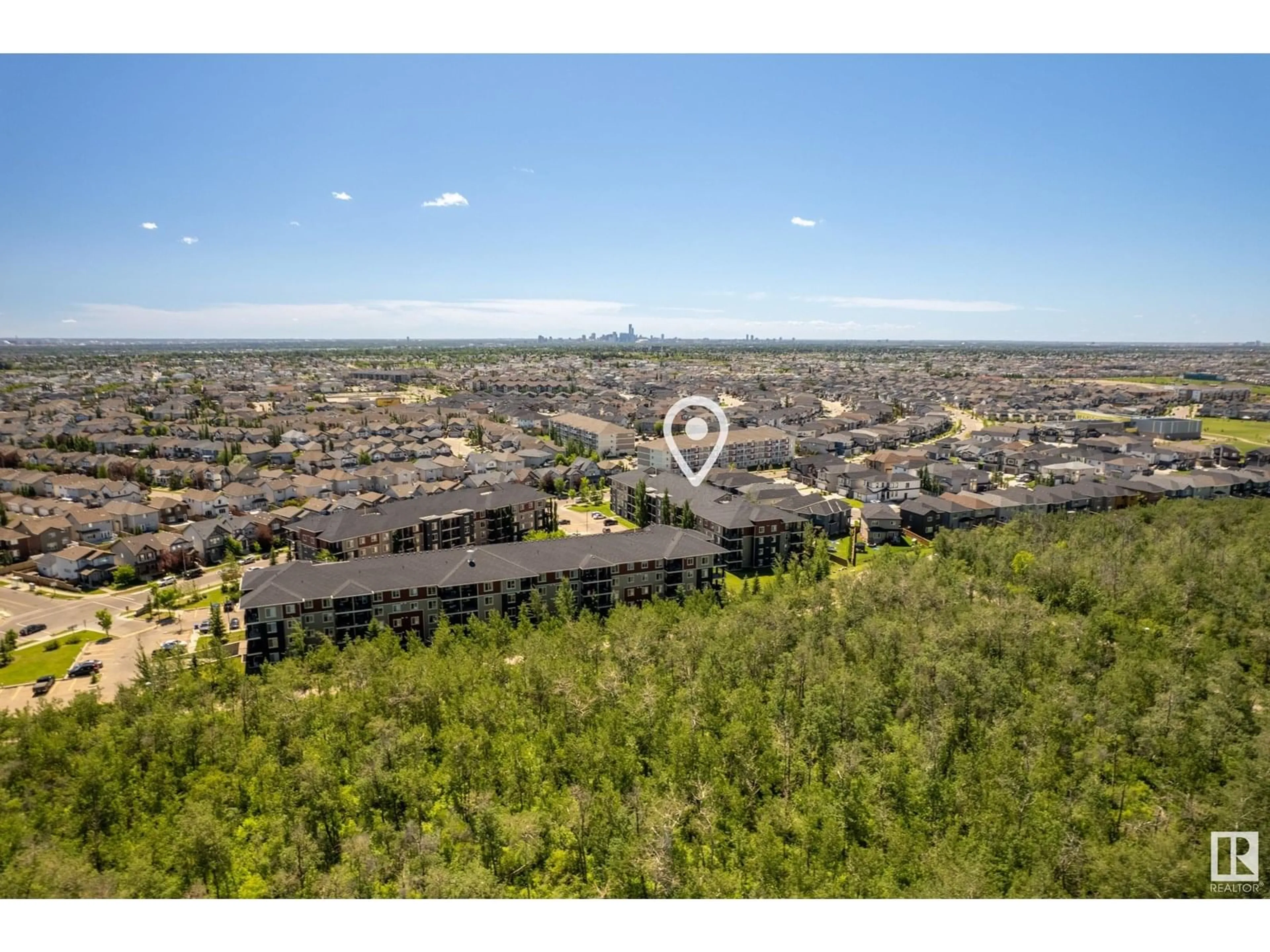 A pic from outside/outdoor area/front of a property/back of a property/a pic from drone, water/lake/river/ocean view for 404 - 1060 MCCONACHIE BV, Edmonton Alberta T5Y0W9