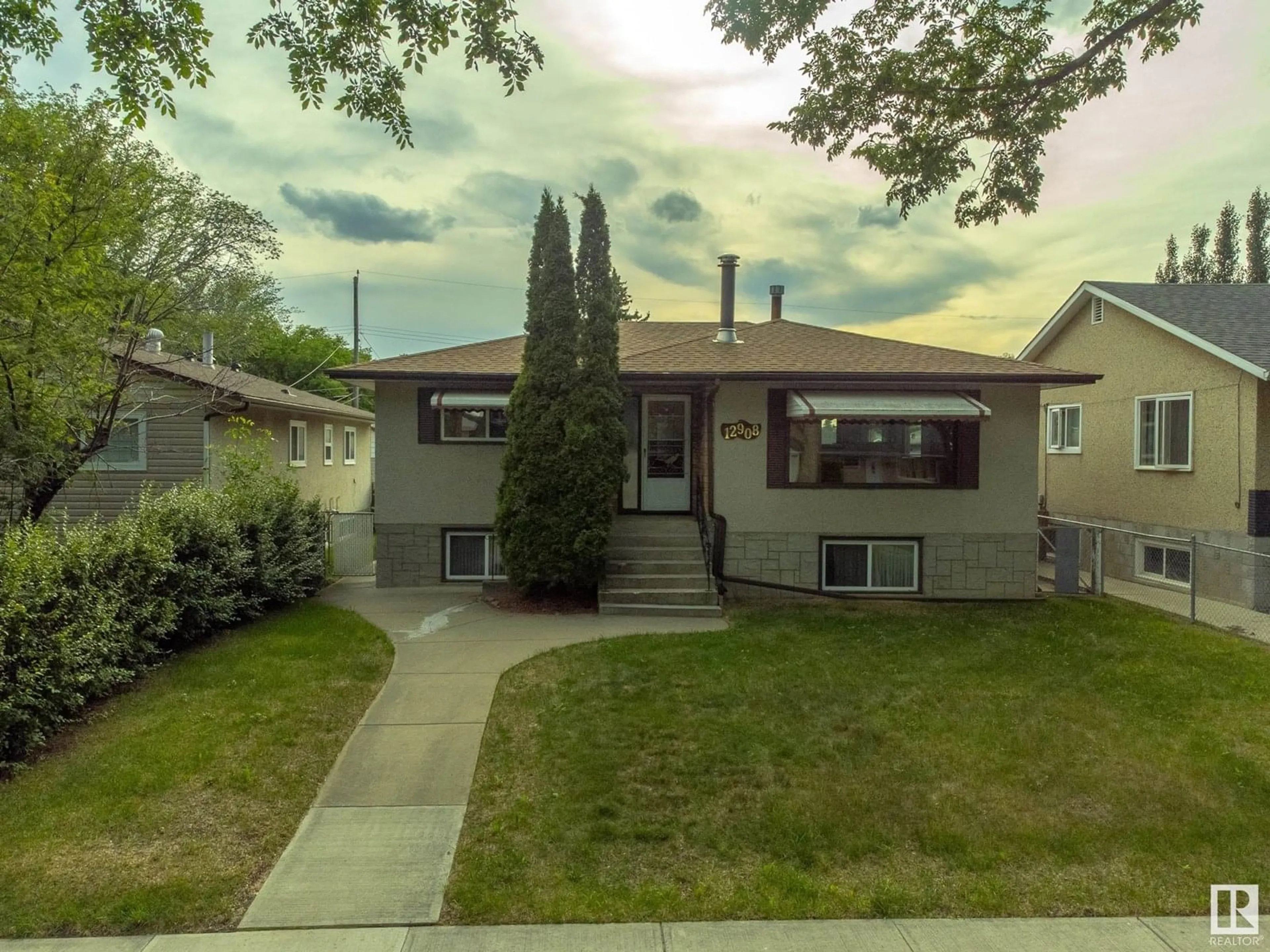 Home with vinyl exterior material, street for 12908 104 ST, Edmonton Alberta T5E4N9