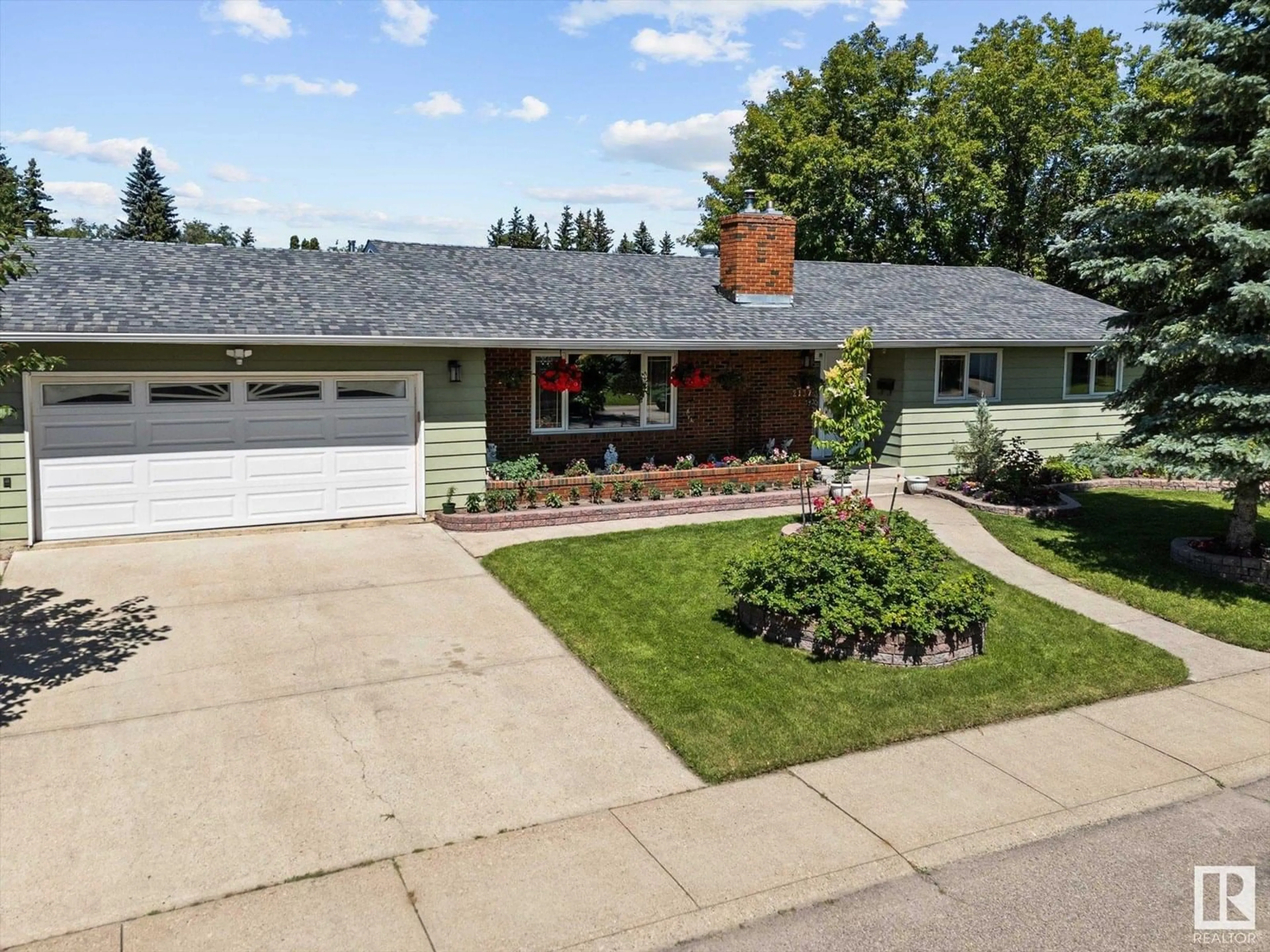Home with brick exterior material, street for NW - 2137 85 ST, Edmonton Alberta T6K2G1
