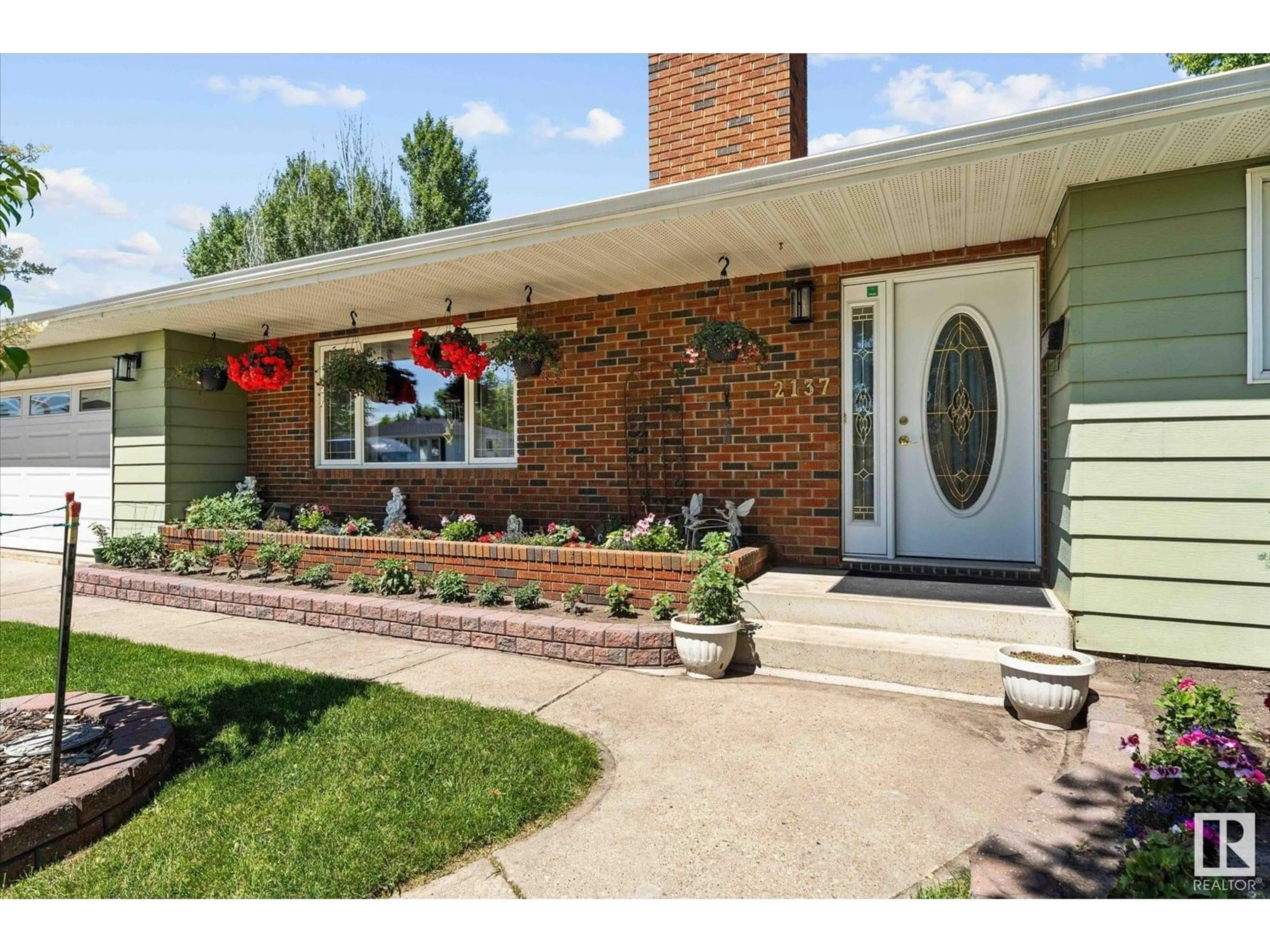 Home with brick exterior material, street for NW - 2137 85 ST, Edmonton Alberta T6K2G1