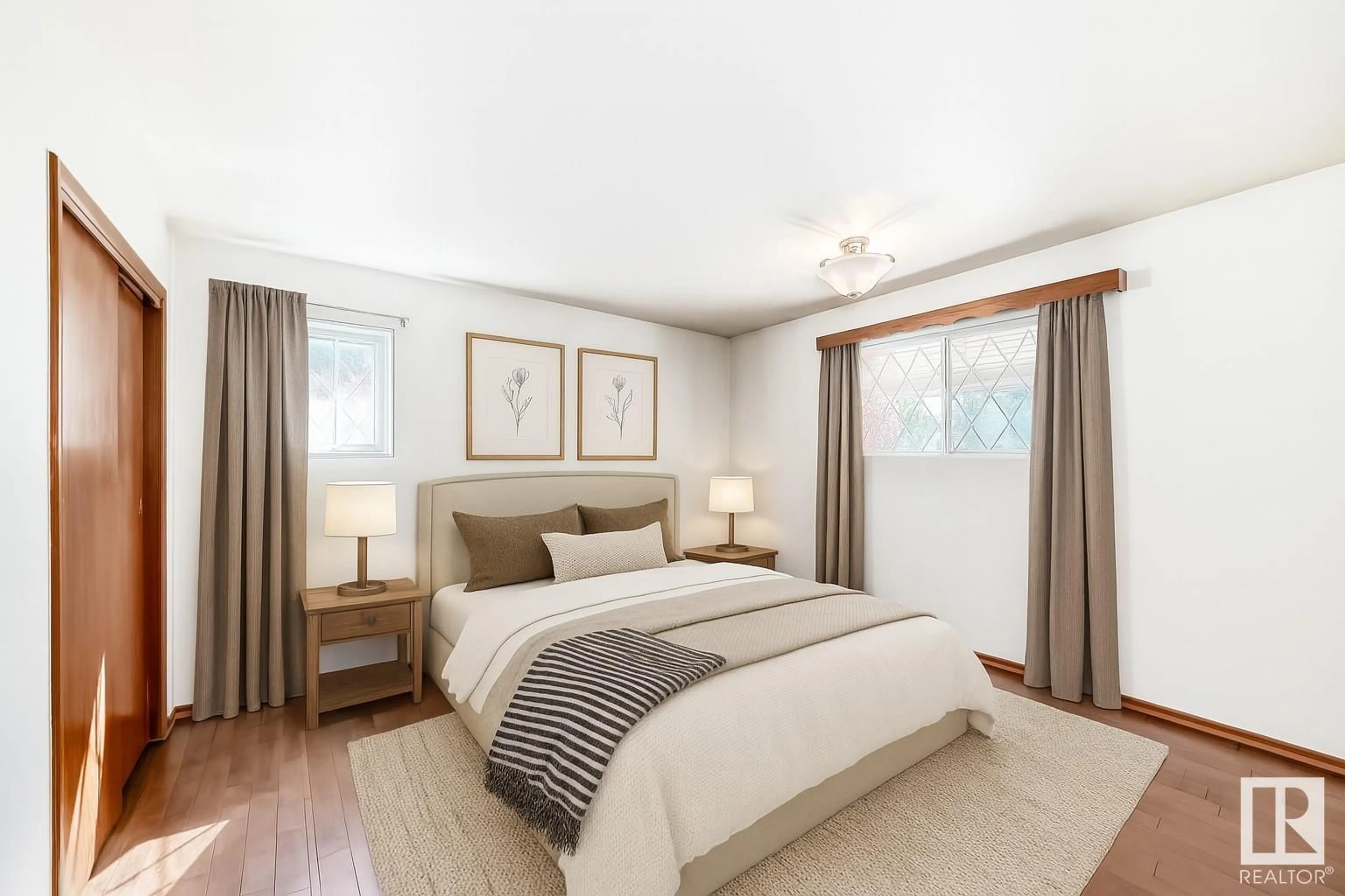 Bedroom with bed, wood/laminate floor for 10607 132 AV, Edmonton Alberta T5E0Z3