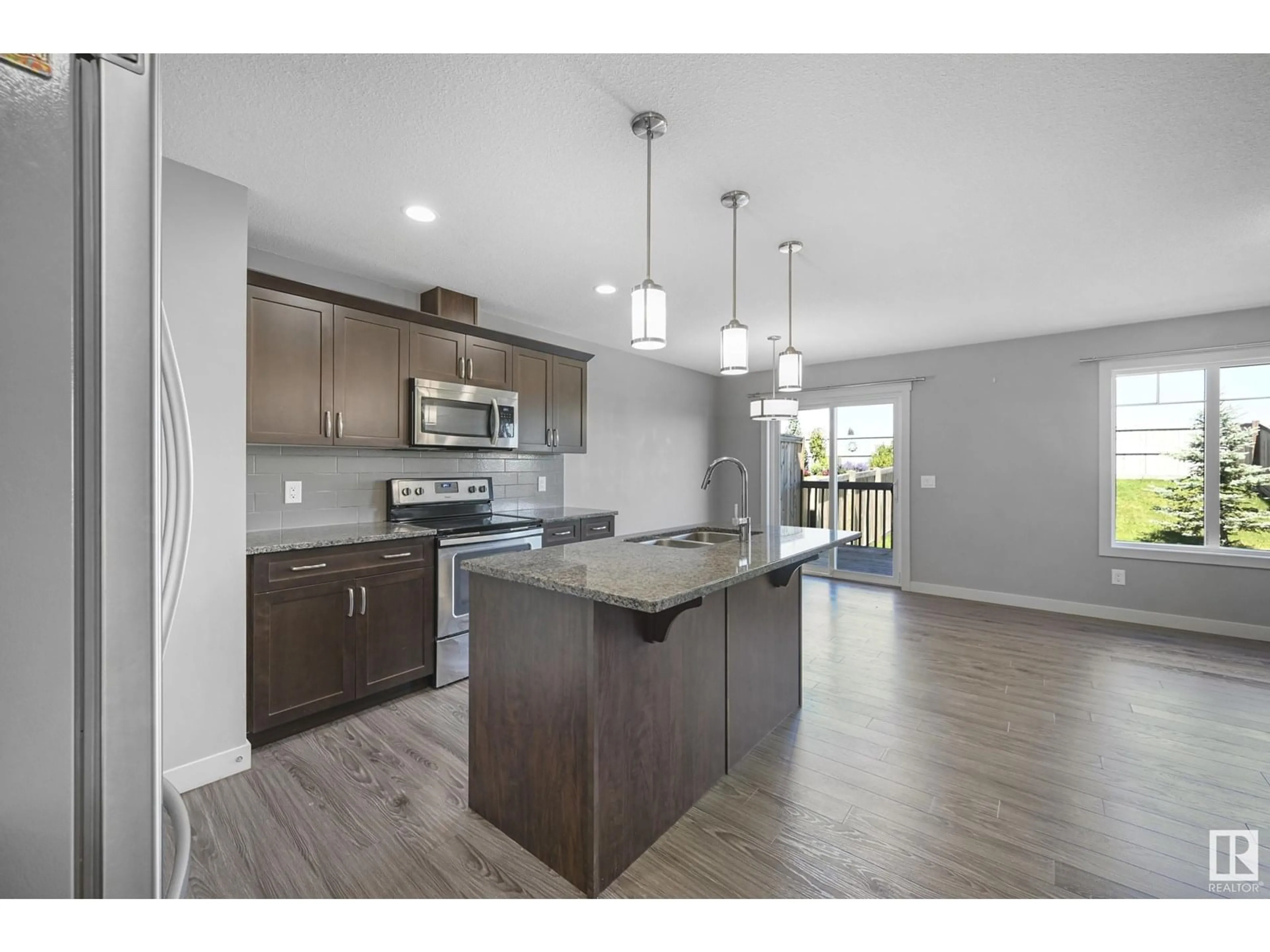 Open concept kitchen, unknown for 16704 14 AV, Edmonton Alberta T6W3C3