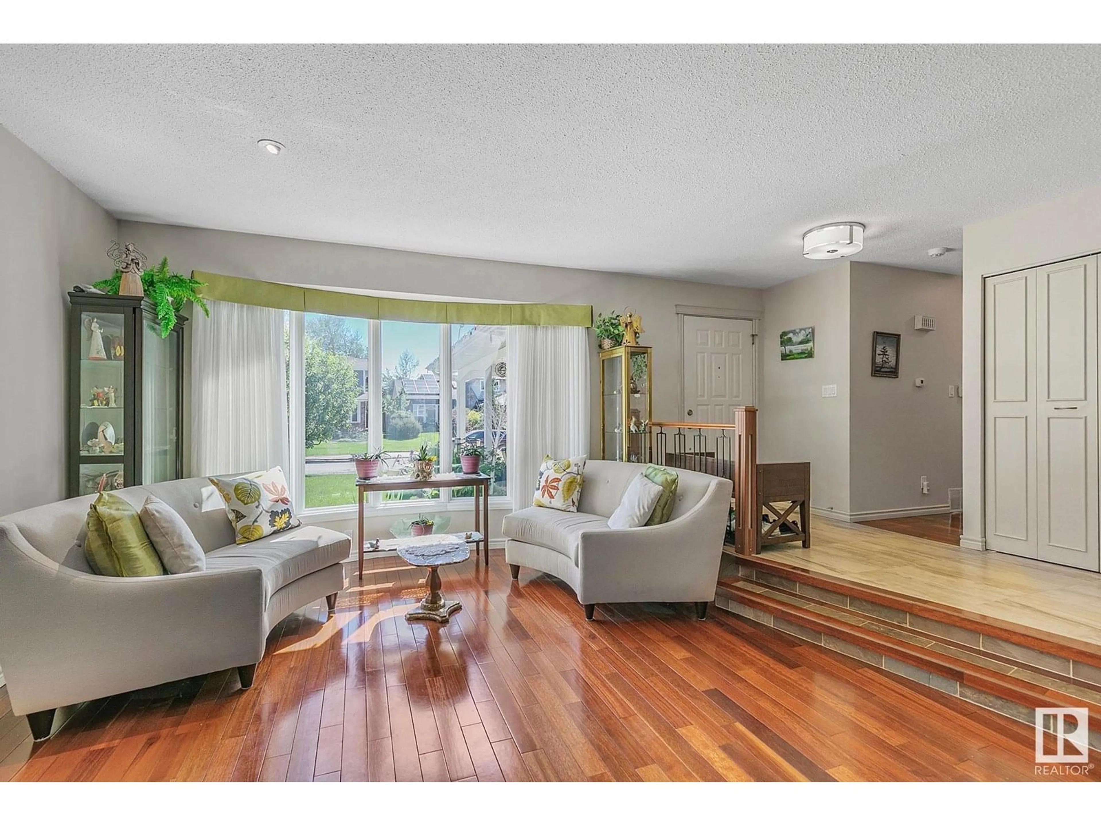 Living room with furniture, wood/laminate floor for 208 GARIEPY CR, Edmonton Alberta T6M1A2