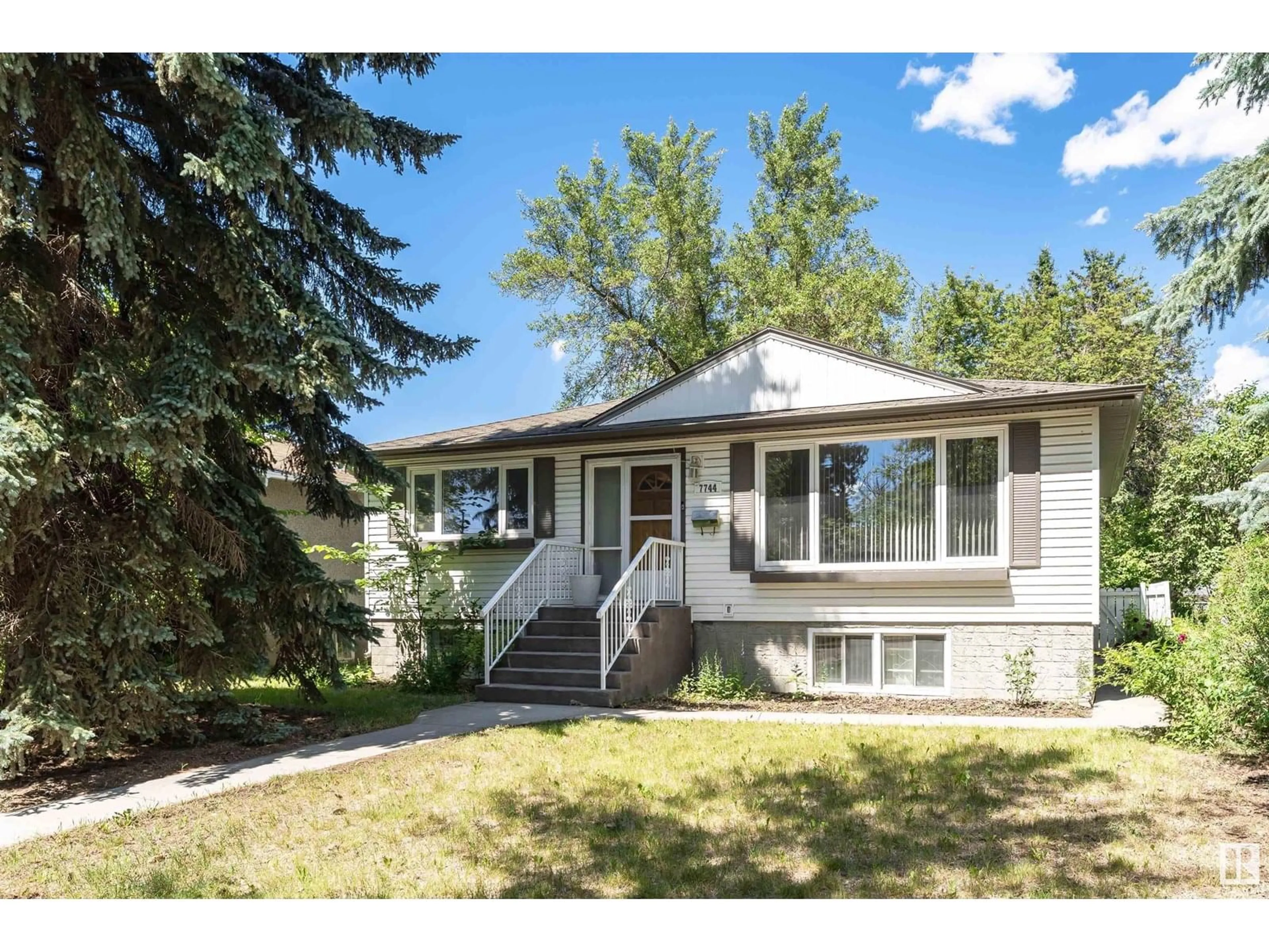 Home with vinyl exterior material, street for NW - 7744 83 AV, Edmonton Alberta T6C1A4