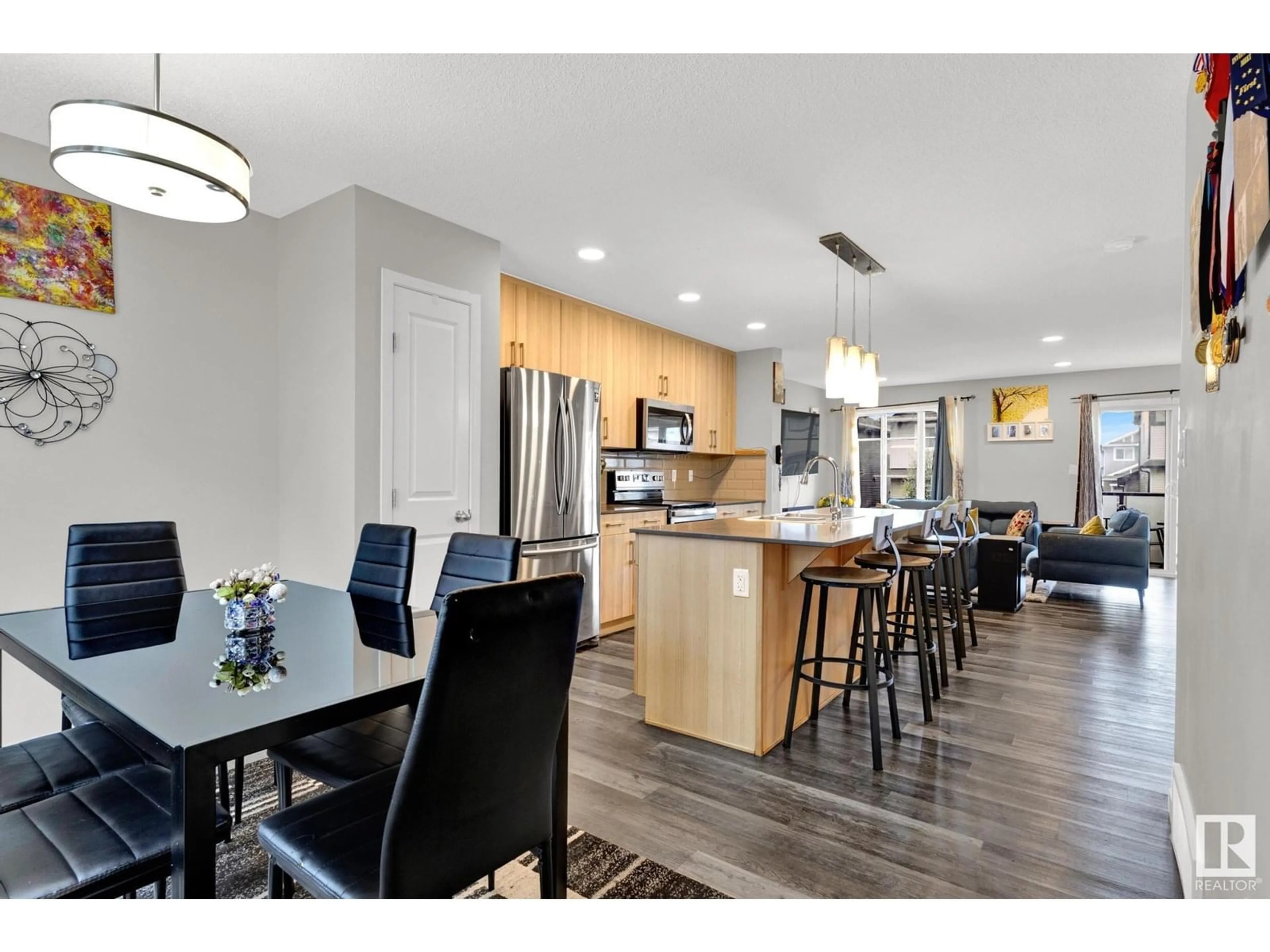 Open concept kitchen, wood/laminate floor for #45 - 2905 141 ST, Edmonton Alberta T6W3M4