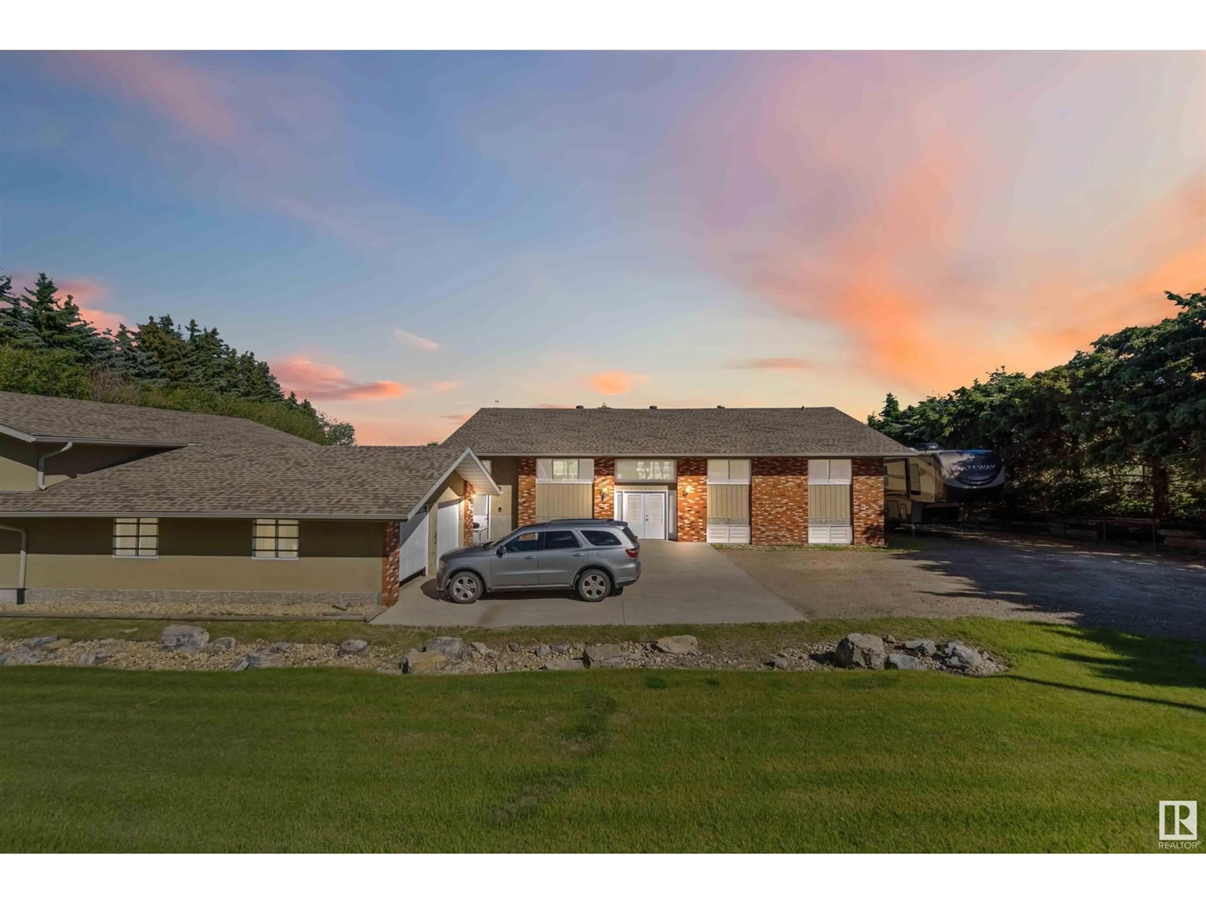 A pic from outside/outdoor area/front of a property/back of a property/a pic from drone, street for 23 - 55305 RGE ROAD 242, Rural Sturgeon County Alberta T5E5S7