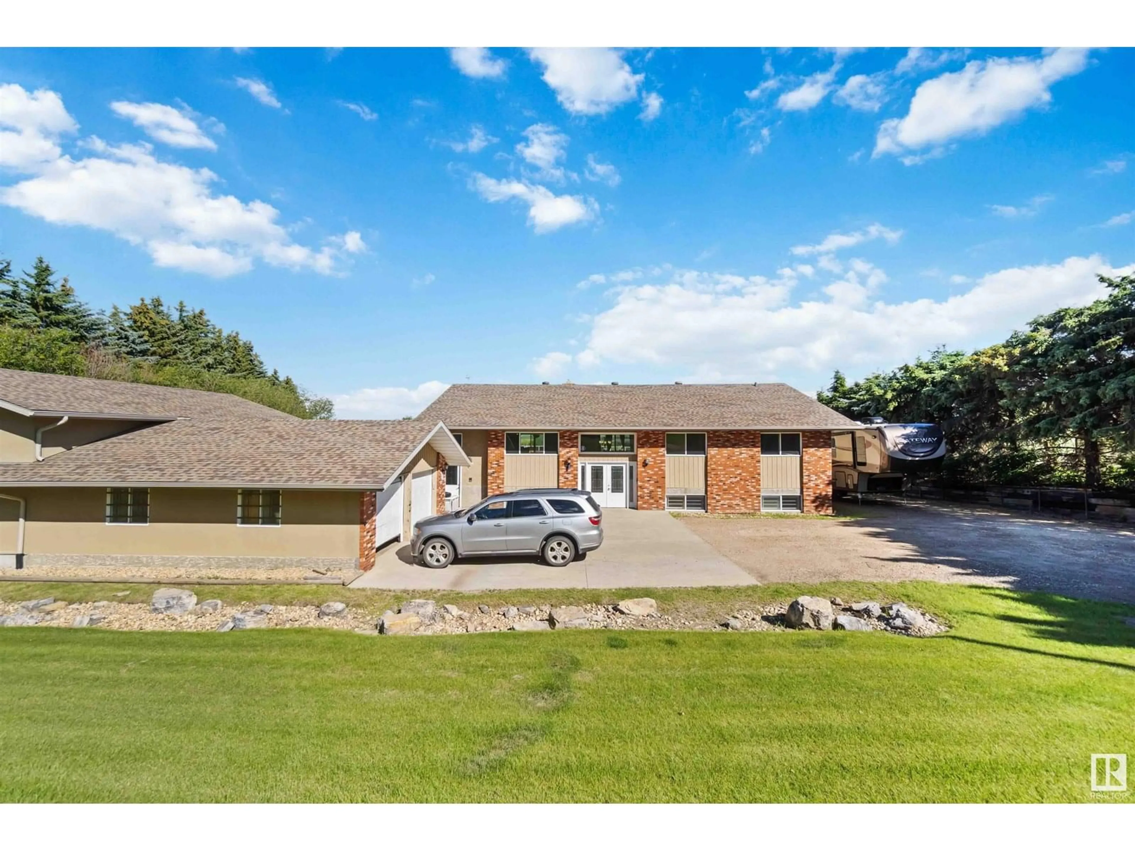 A pic from outside/outdoor area/front of a property/back of a property/a pic from drone, unknown for 23 - 55305 RGE ROAD 242, Rural Sturgeon County Alberta T5E5S7