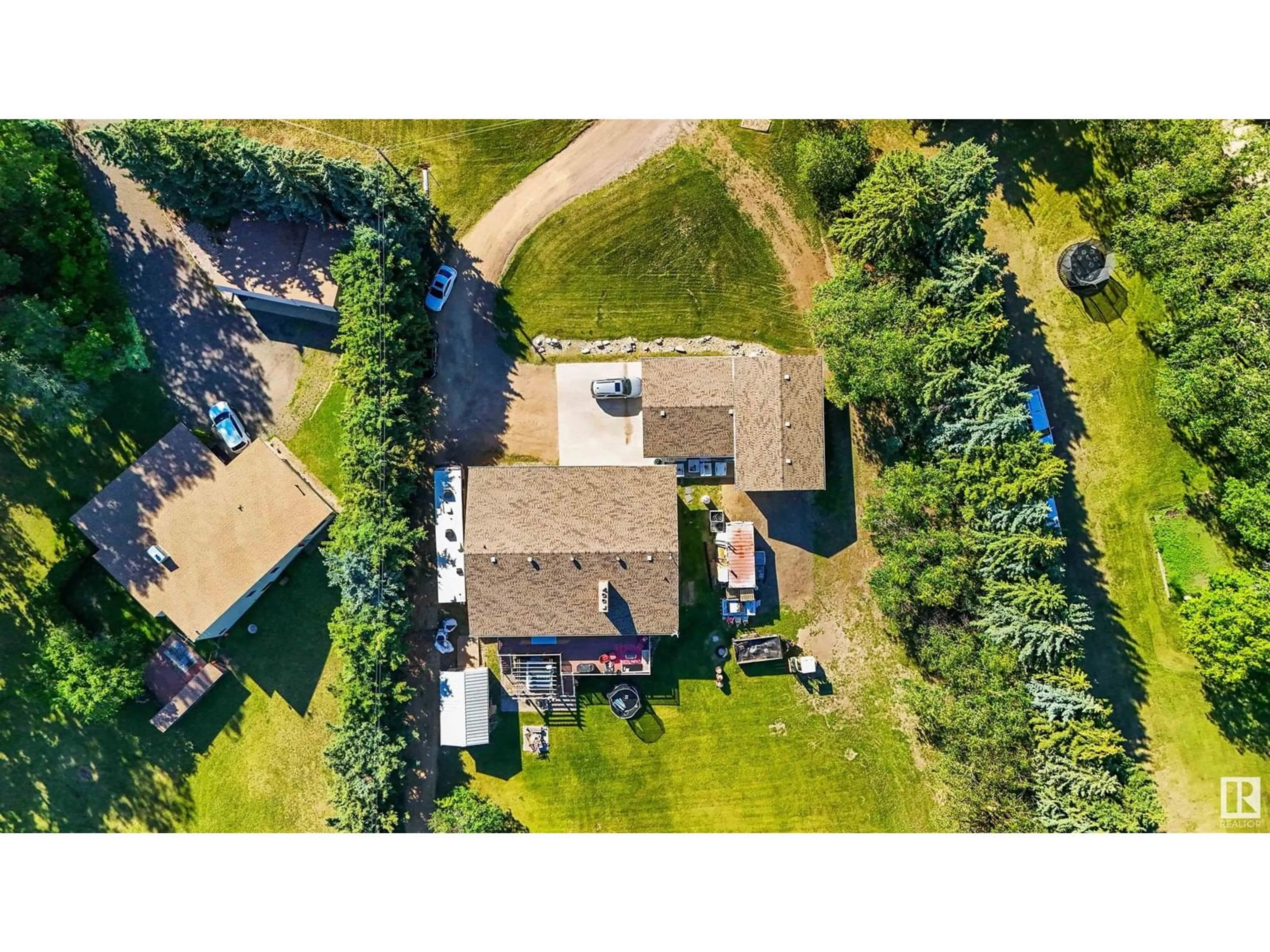 A pic from outside/outdoor area/front of a property/back of a property/a pic from drone, street for 23 - 55305 RGE ROAD 242, Rural Sturgeon County Alberta T5E5S7