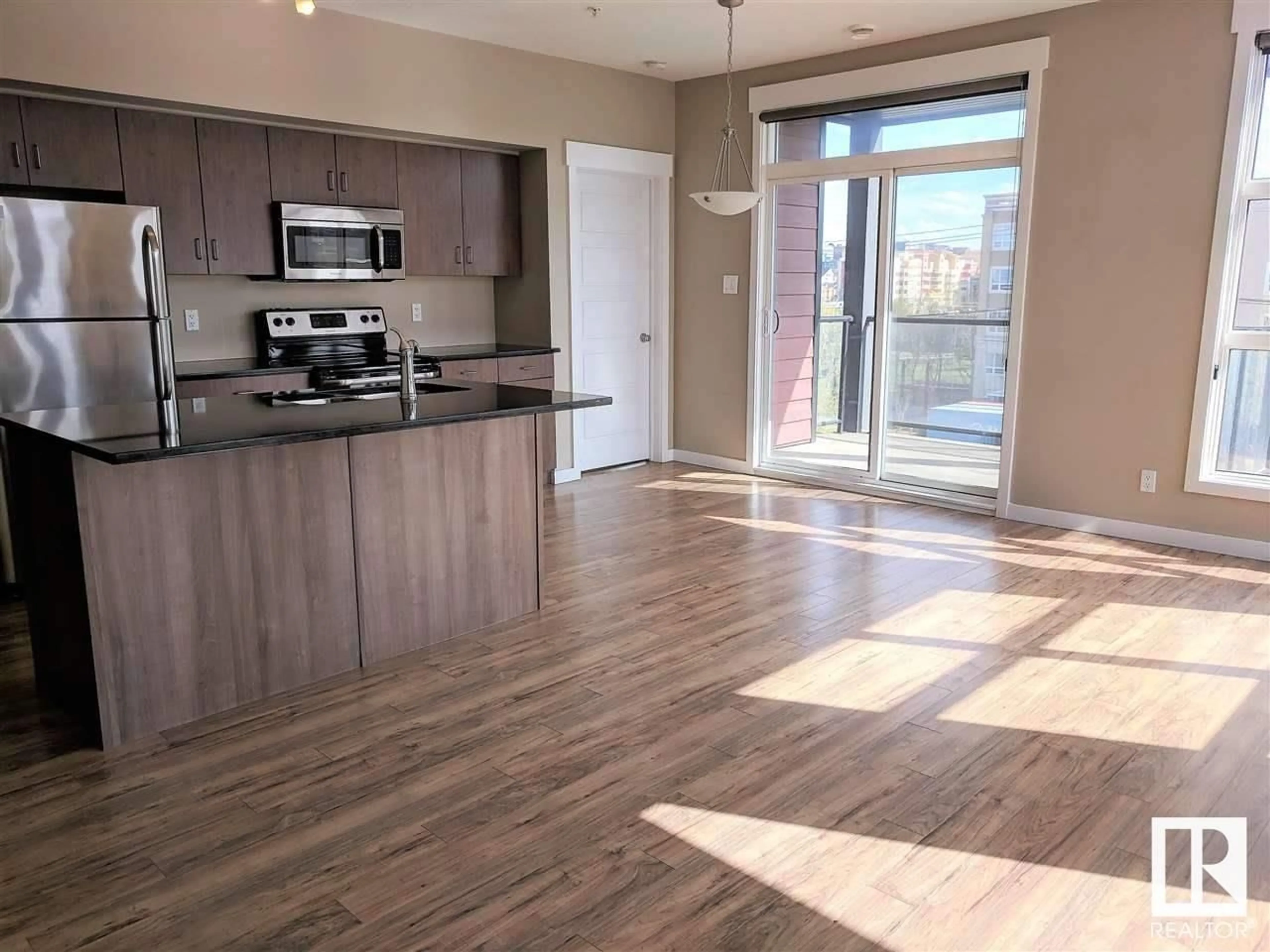 Open concept kitchen, wood/laminate floor for #405 - 10518 113 ST, Edmonton Alberta T5H0C6