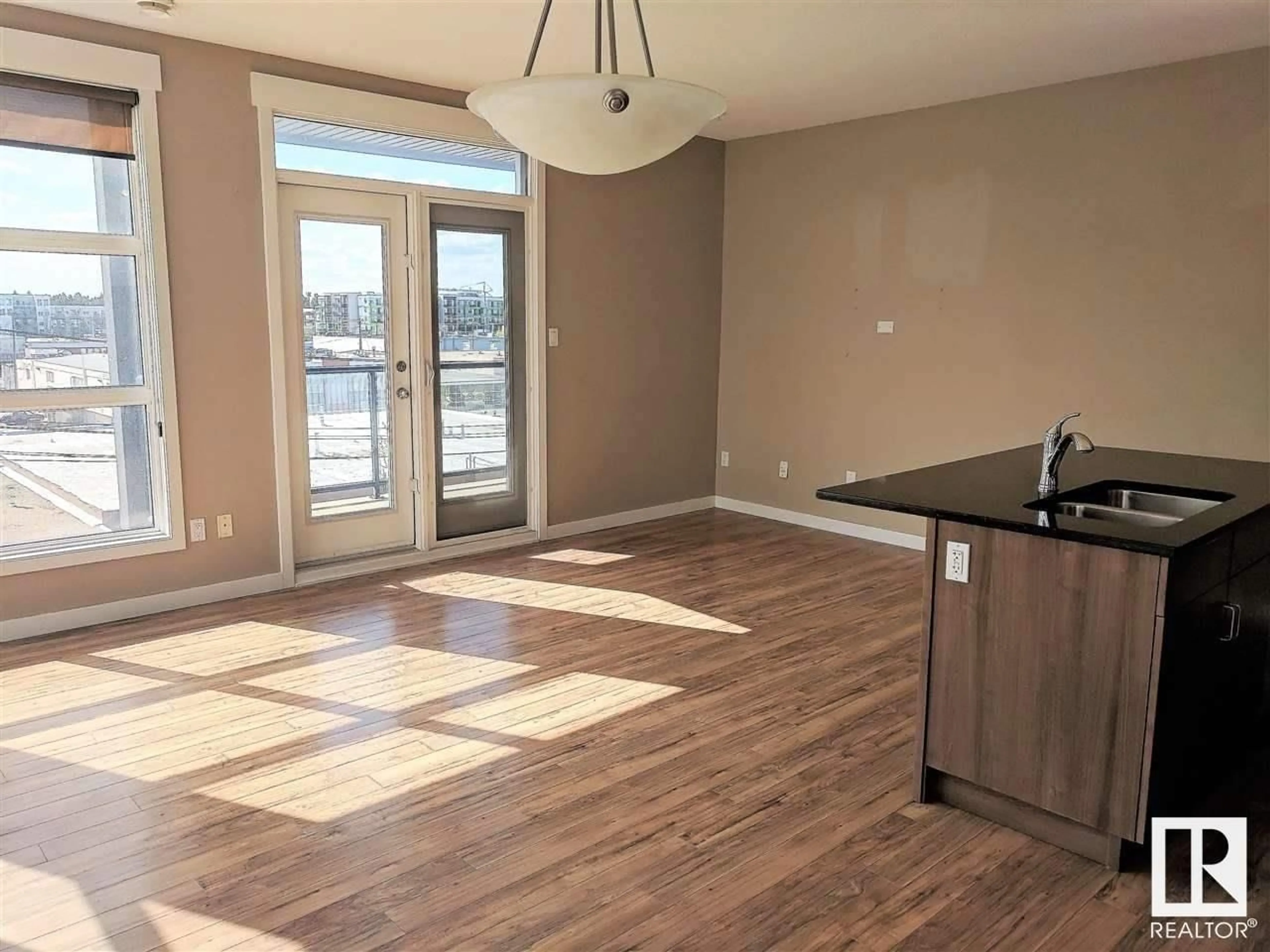 Open concept kitchen, wood/laminate floor for #405 - 10518 113 ST, Edmonton Alberta T5H0C6