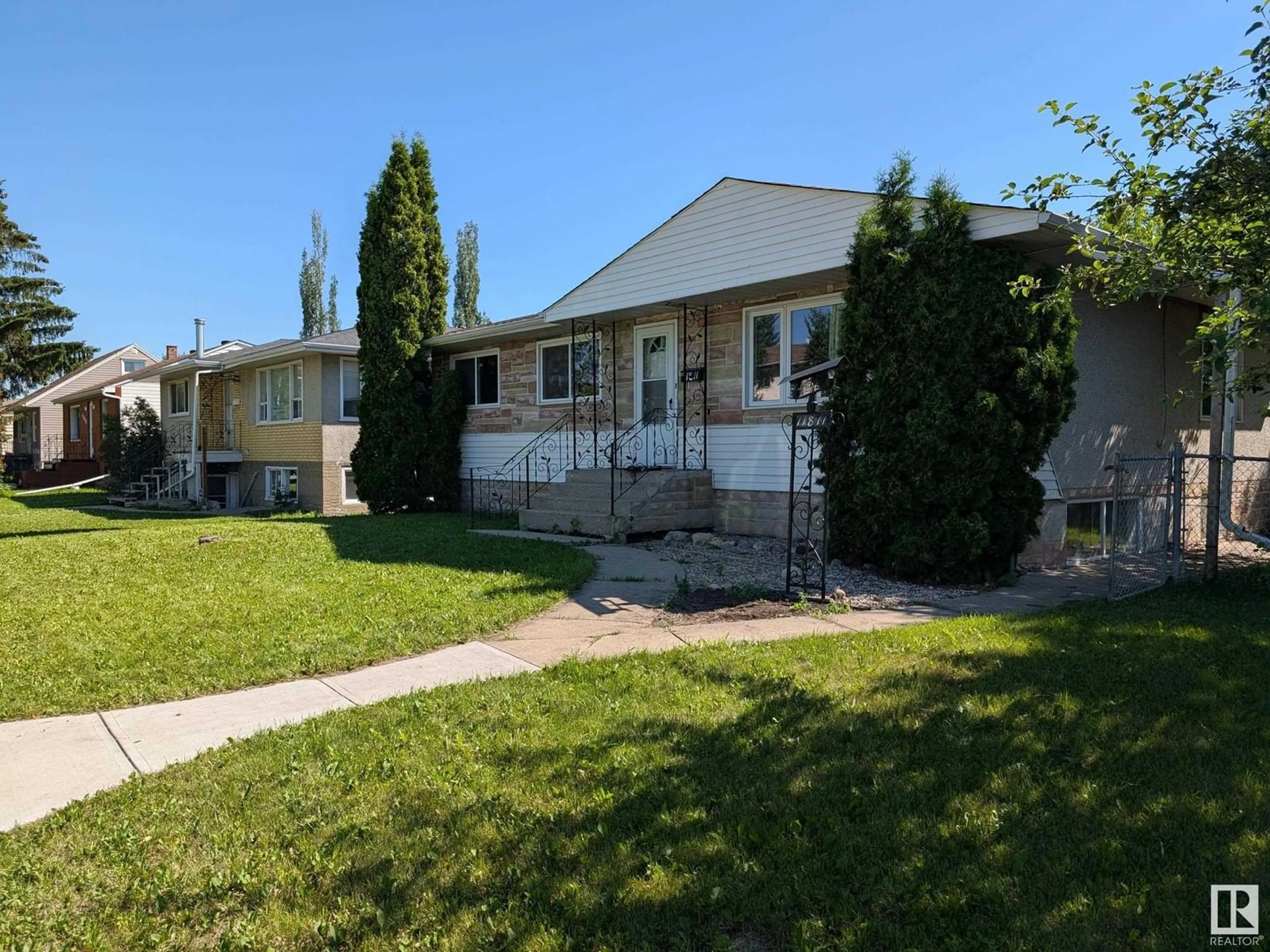 Home with vinyl exterior material, street for NW - 11811 122 ST, Edmonton Alberta T5L0C3