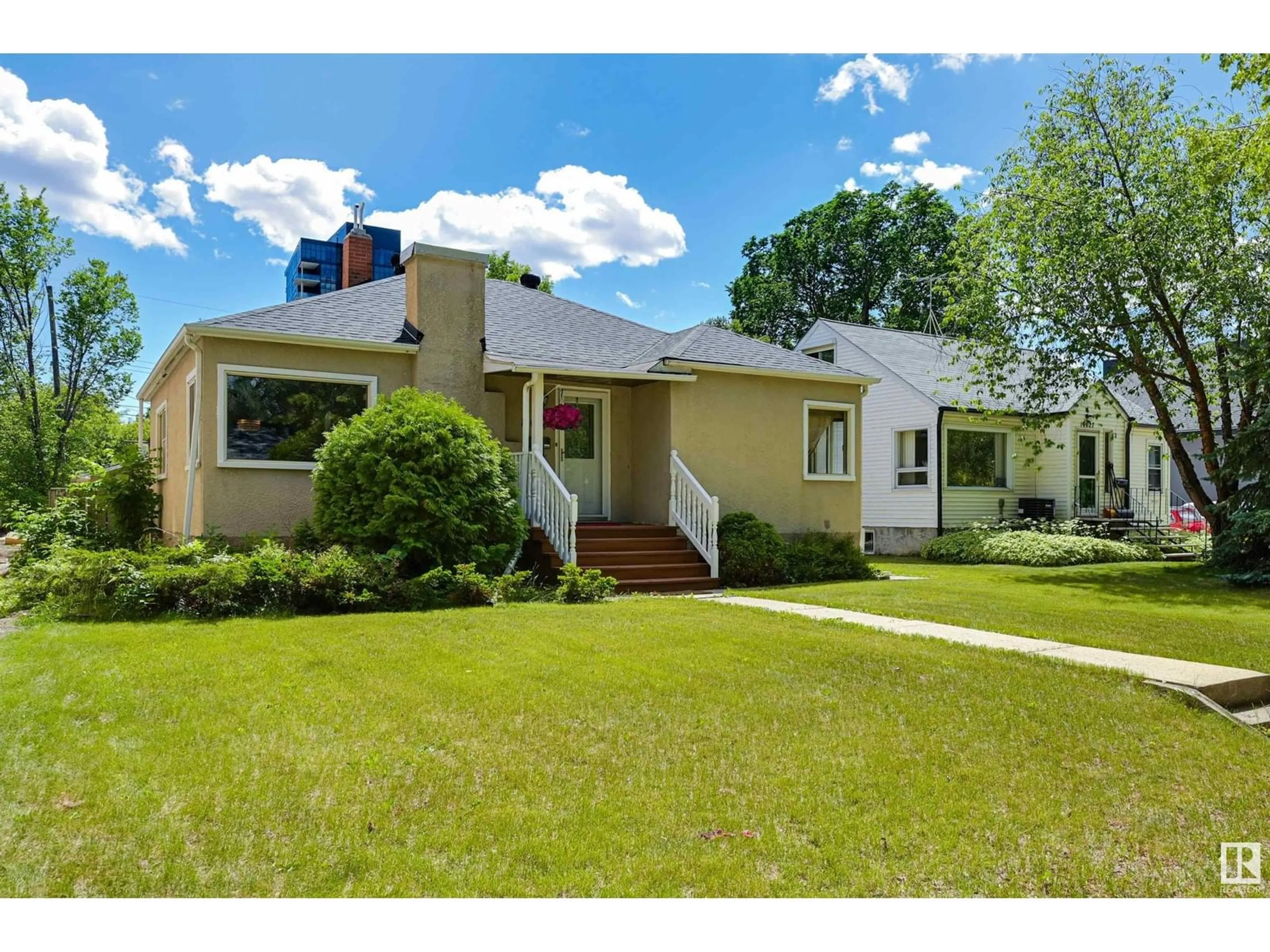Home with vinyl exterior material, street for 14023 104 AV, Edmonton Alberta T5N0W7