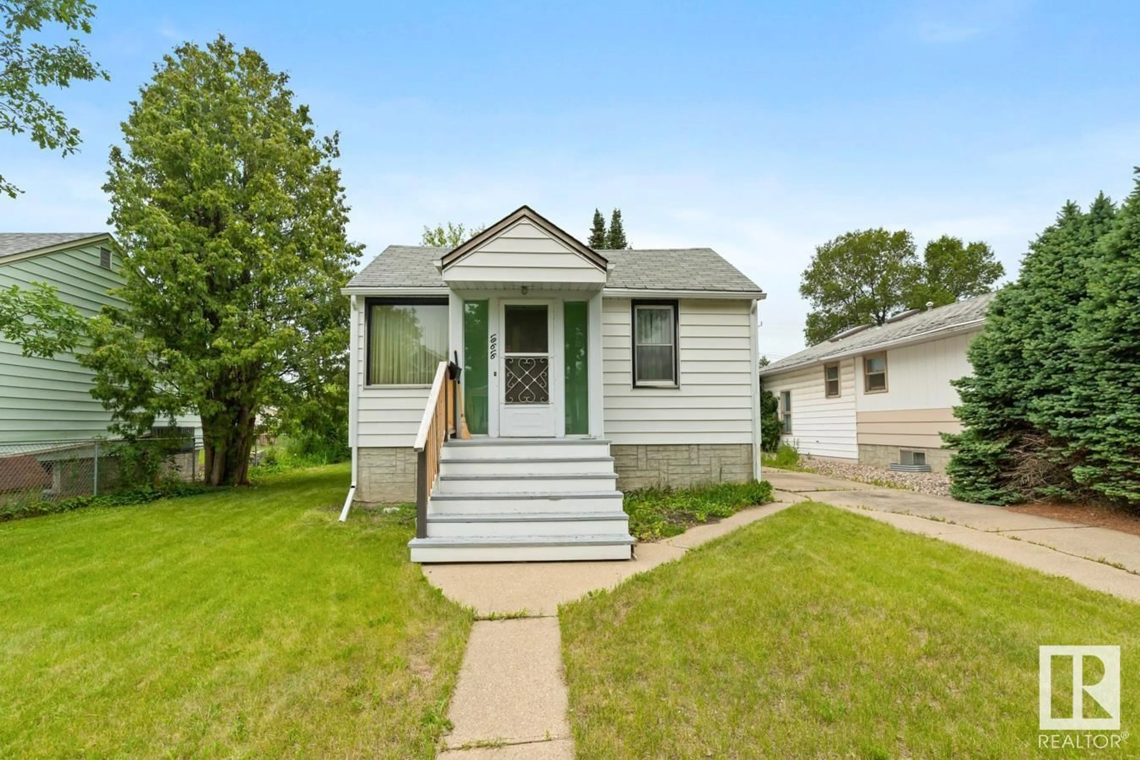 Home with vinyl exterior material, street for 10616 150 ST, Edmonton Alberta T5P1R2