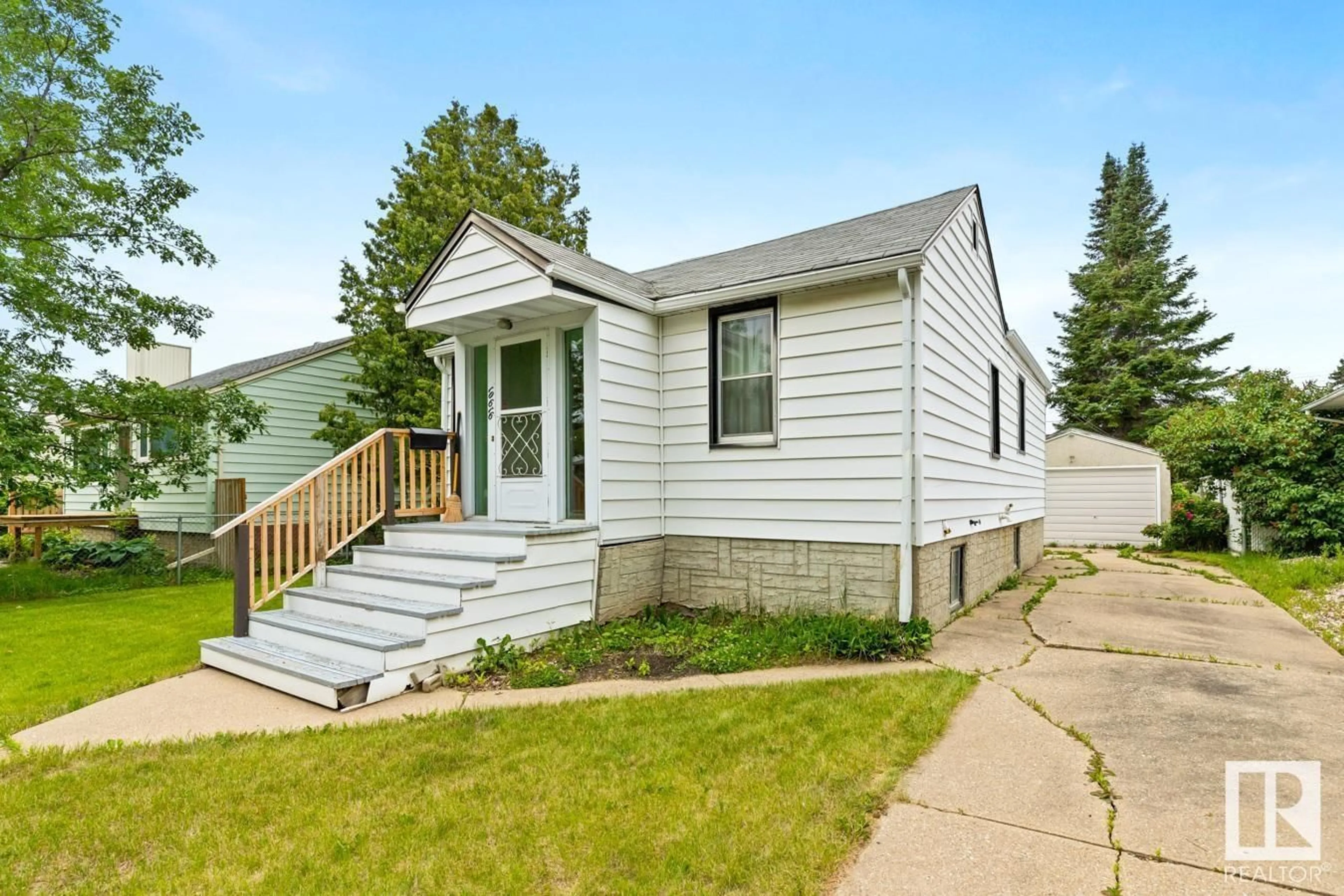 Home with vinyl exterior material, street for 10616 150 ST, Edmonton Alberta T5P1R2