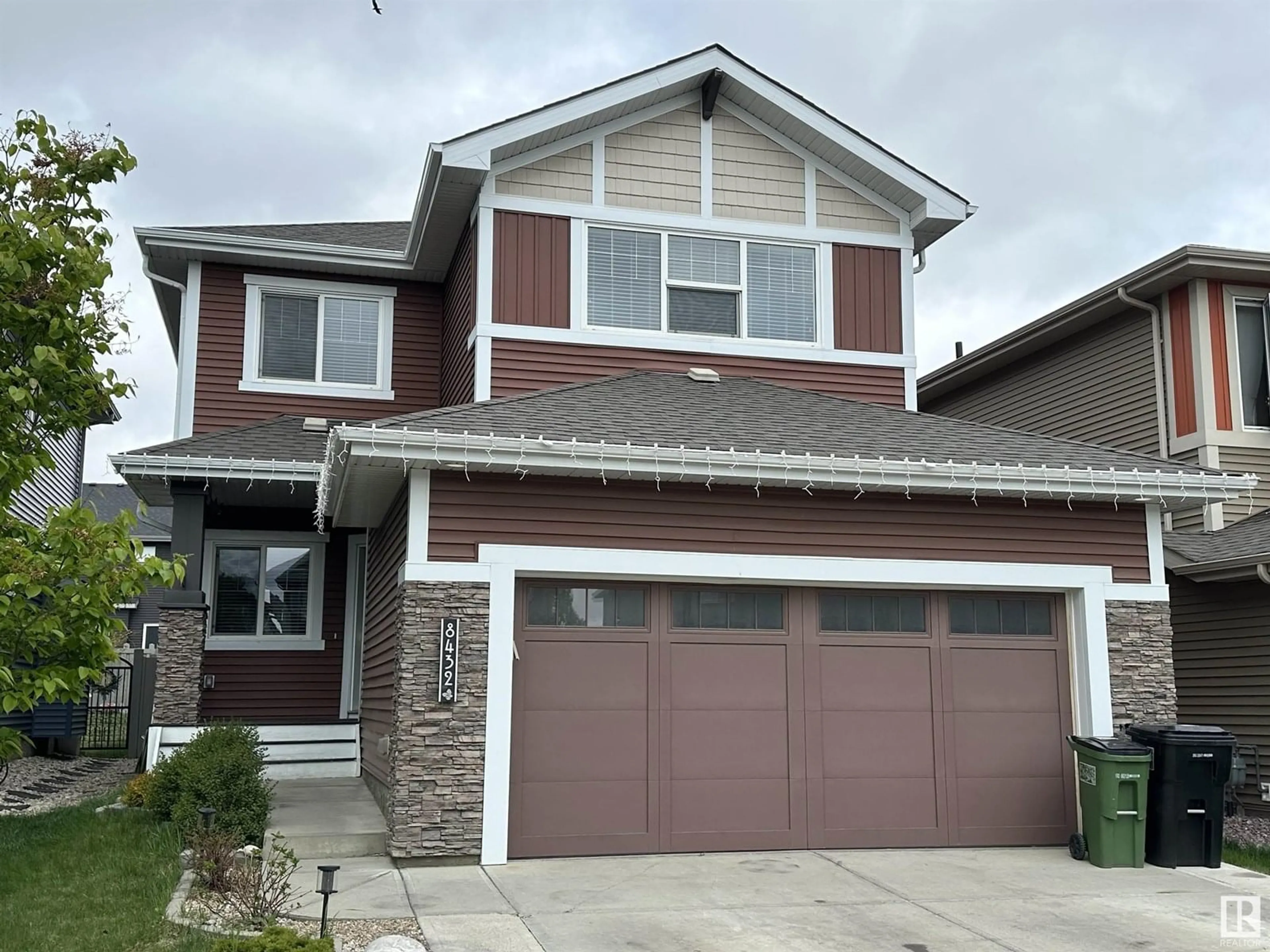 Home with vinyl exterior material, street for NW - 8432 219 ST, Edmonton Alberta T5T7E1