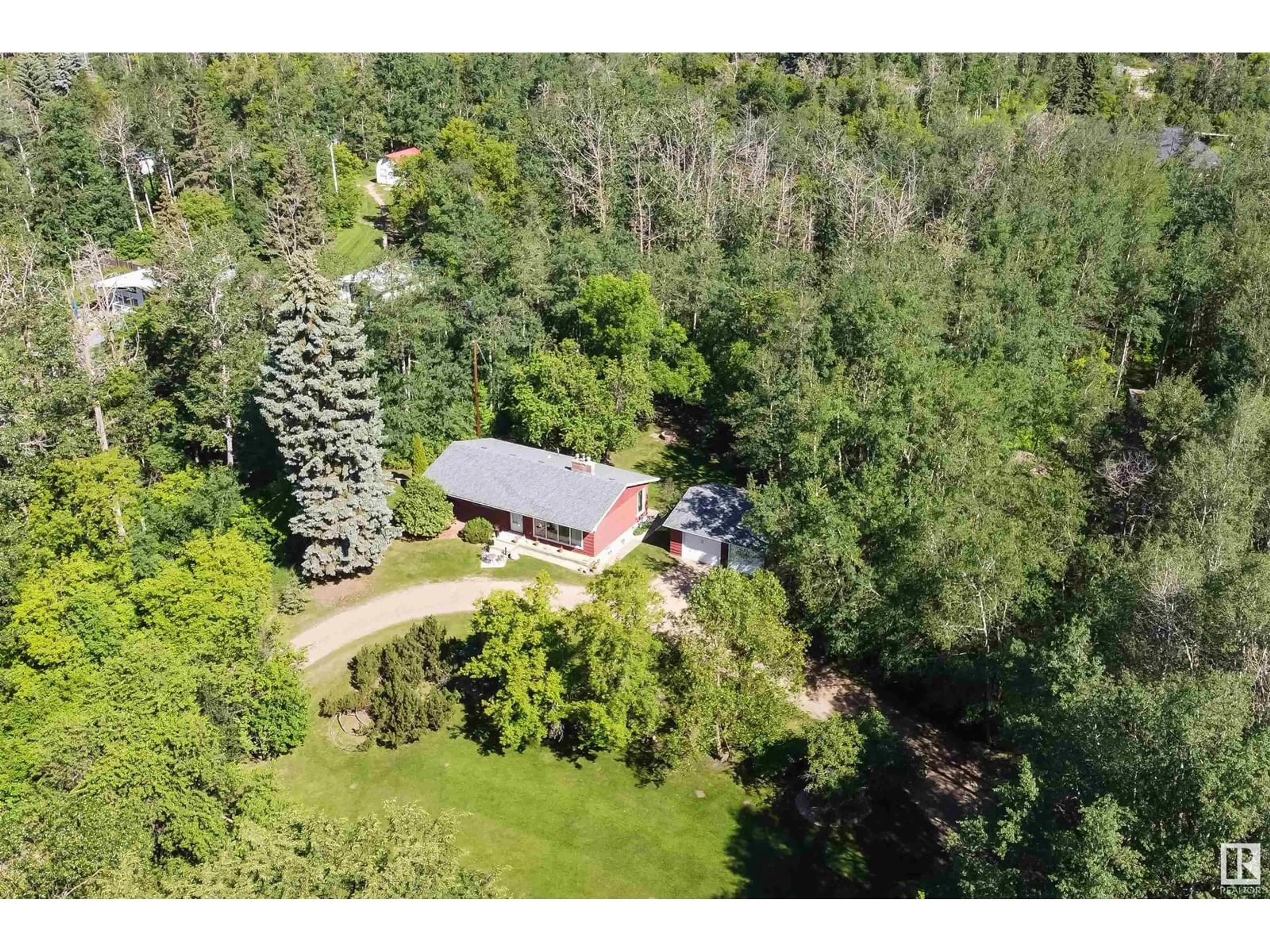 A pic from outside/outdoor area/front of a property/back of a property/a pic from drone, forest/trees view for 22559 - 451 WYE RD, Rural Strathcona County Alberta T8C1H9