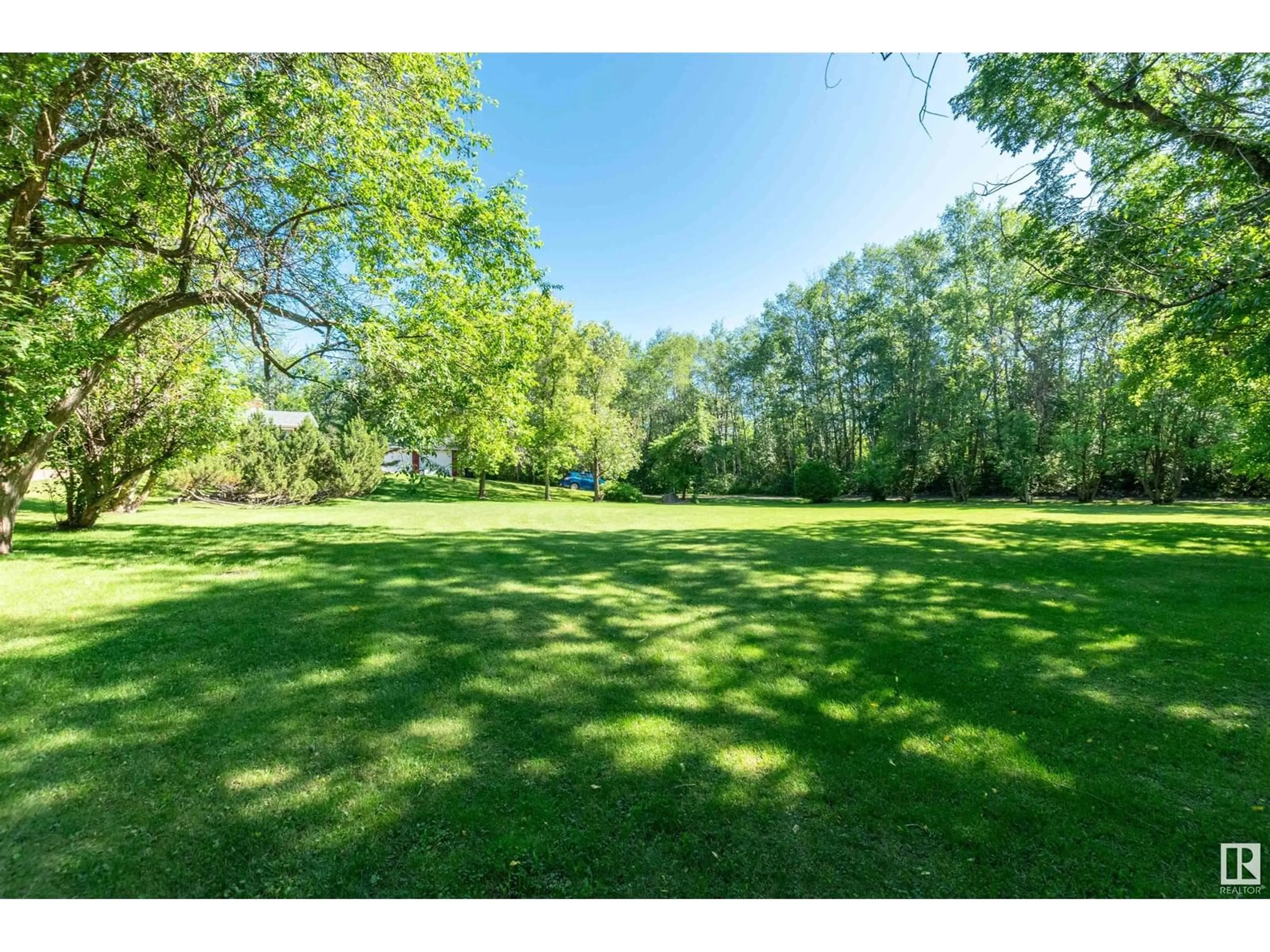 A pic from outside/outdoor area/front of a property/back of a property/a pic from drone, forest/trees view for 22559 - 451 WYE RD, Rural Strathcona County Alberta T8C1H9