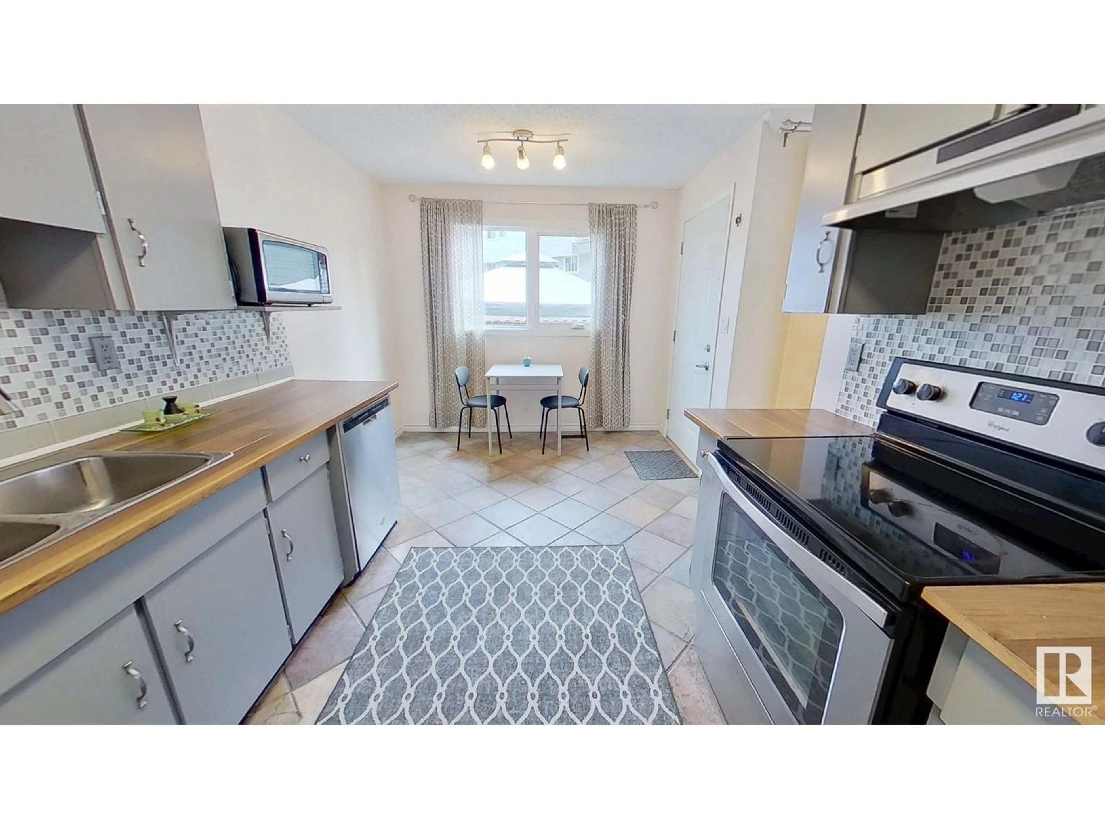 Open concept kitchen, ceramic/tile floor for 12007 162 AV, Edmonton Alberta T5X3R1