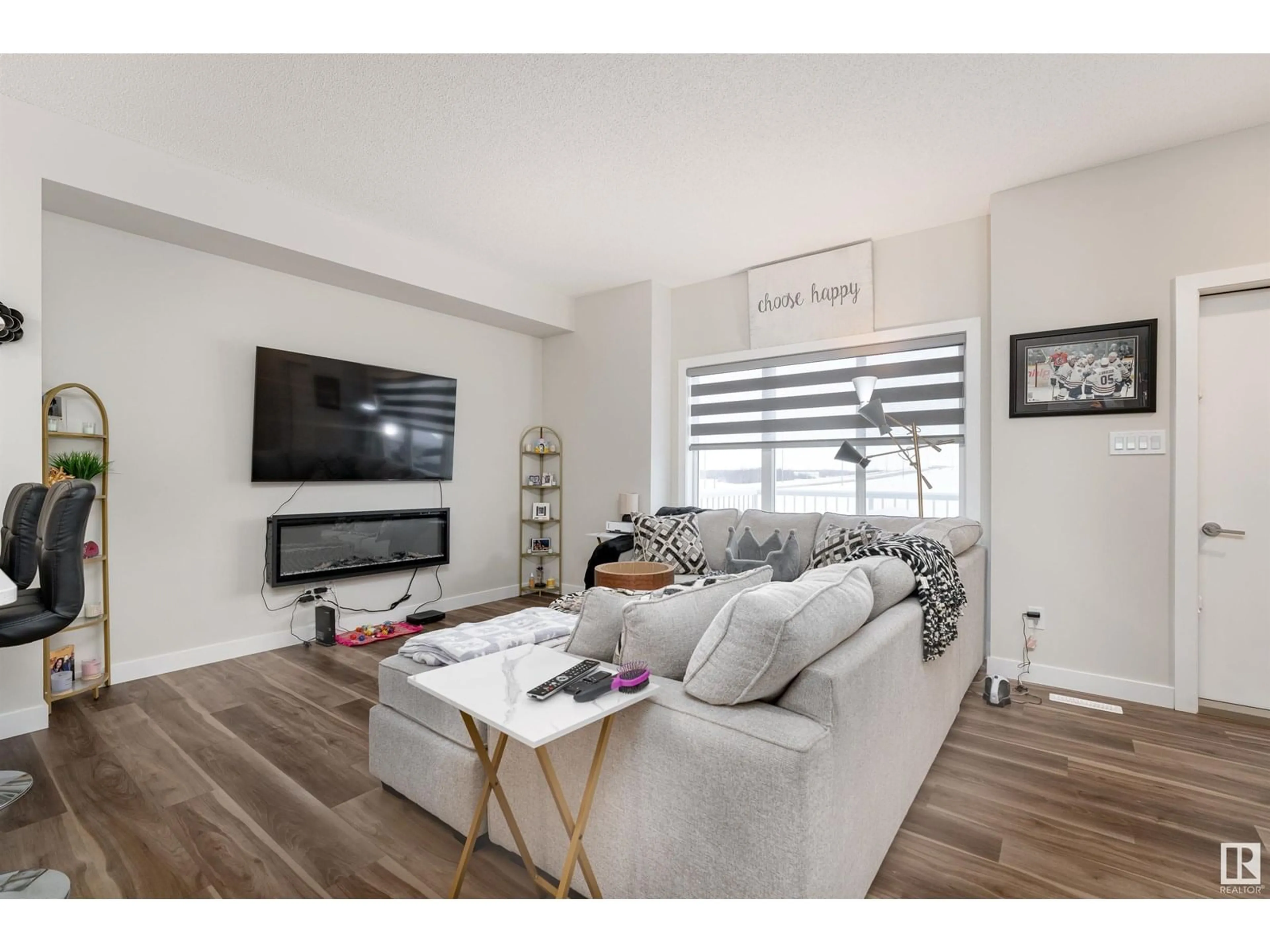Living room with furniture, wood/laminate floor for 17 CRYSTALLINA NERA WY, Edmonton Alberta T5Z0S3