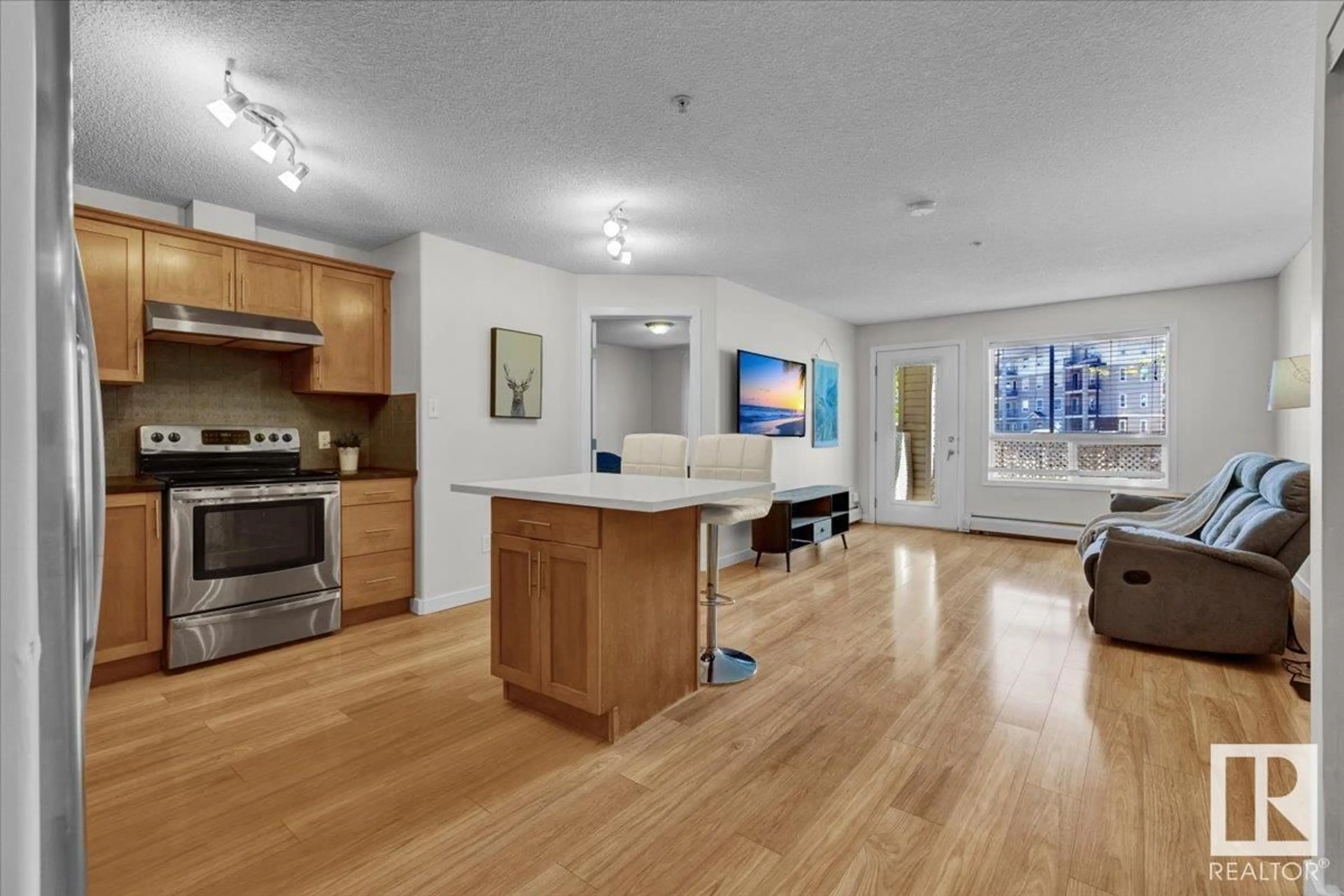 Open concept kitchen, wood/laminate floor for 5102 - 7335 SOUTH TERWILLEGAR DR, Edmonton Alberta T6R0M1
