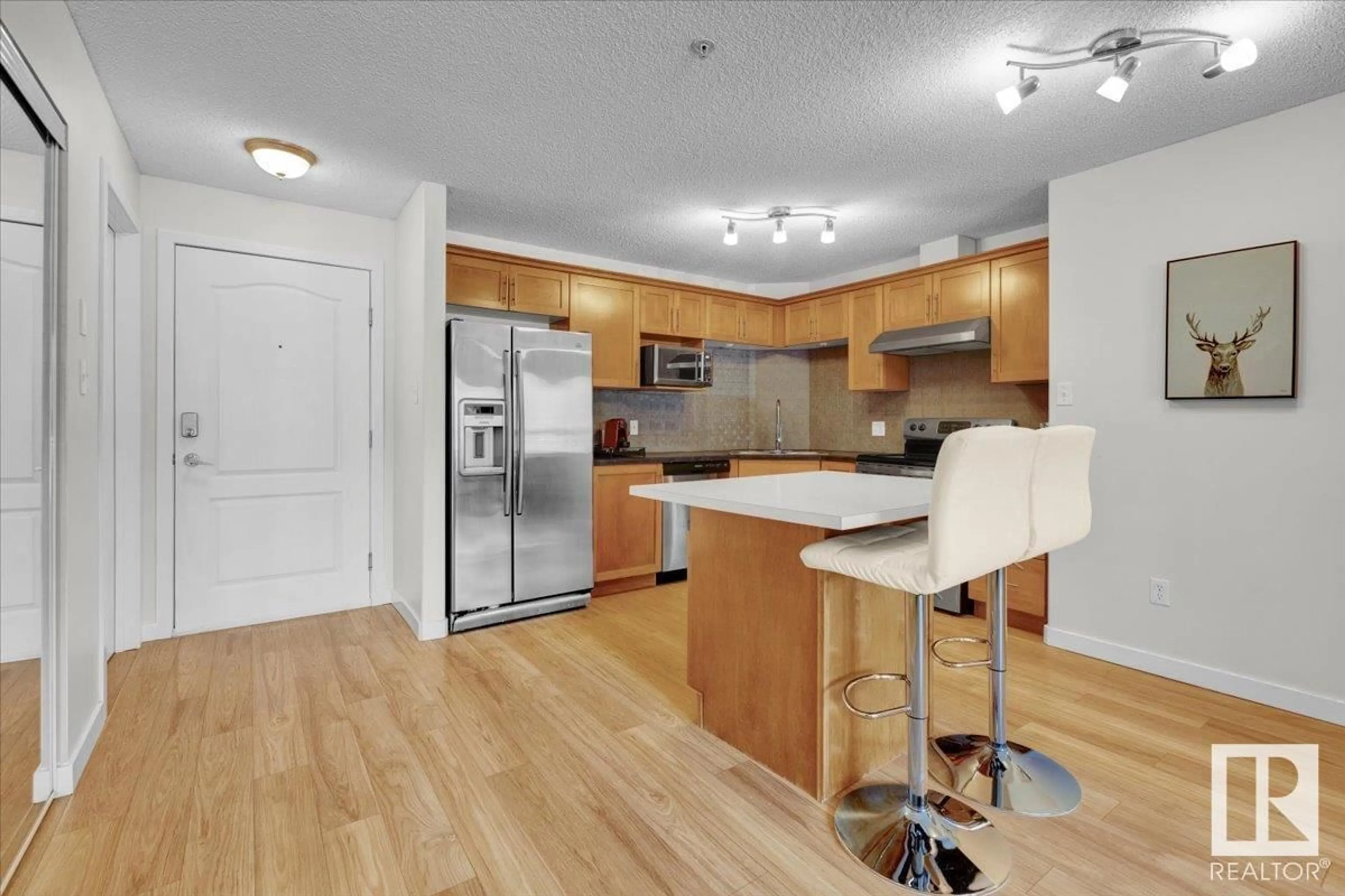 Open concept kitchen, wood/laminate floor for 5102 - 7335 SOUTH TERWILLEGAR DR, Edmonton Alberta T6R0M1