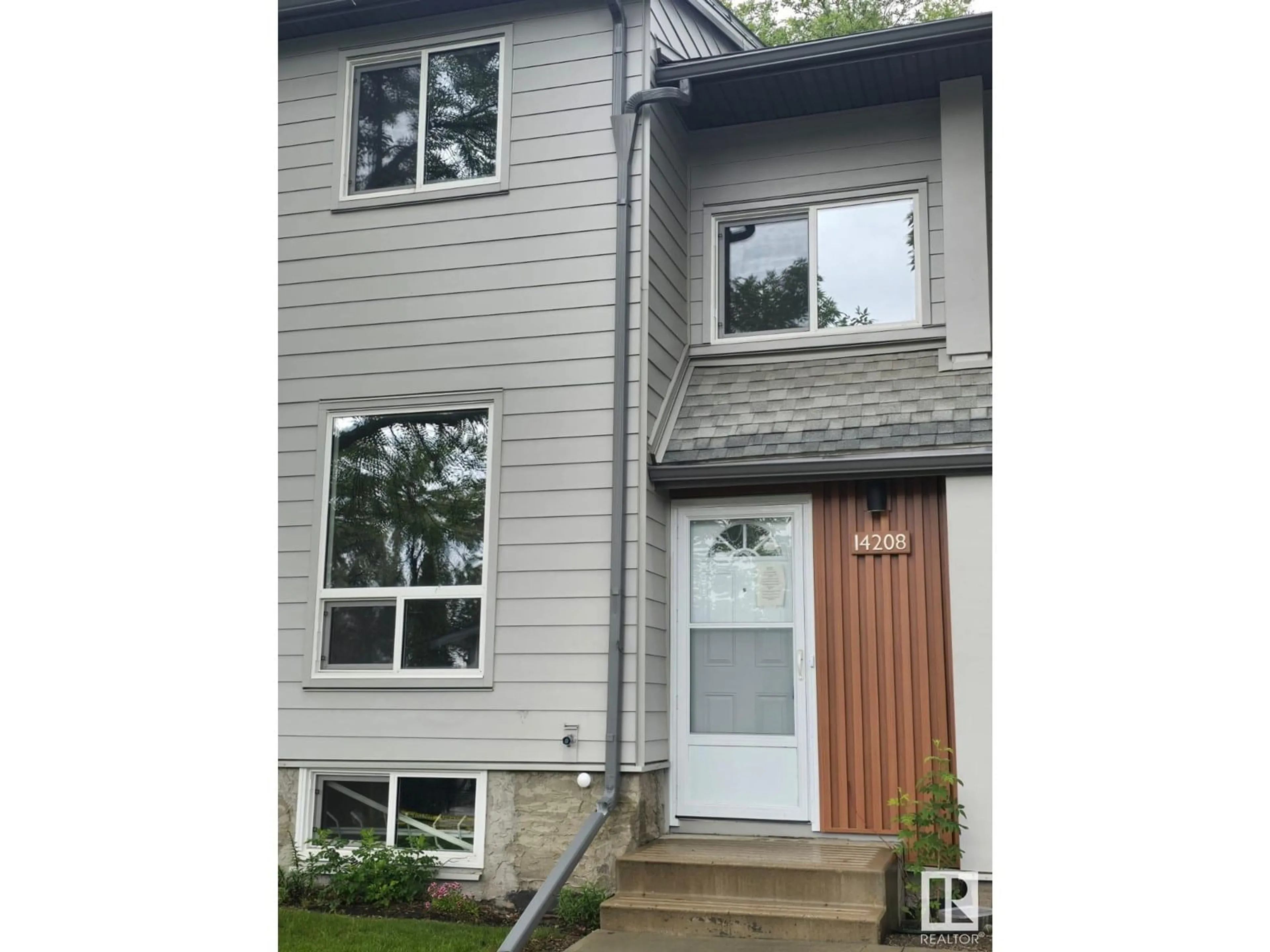Home with vinyl exterior material, street for 14208 31 ST, Edmonton Alberta T5Y1H1