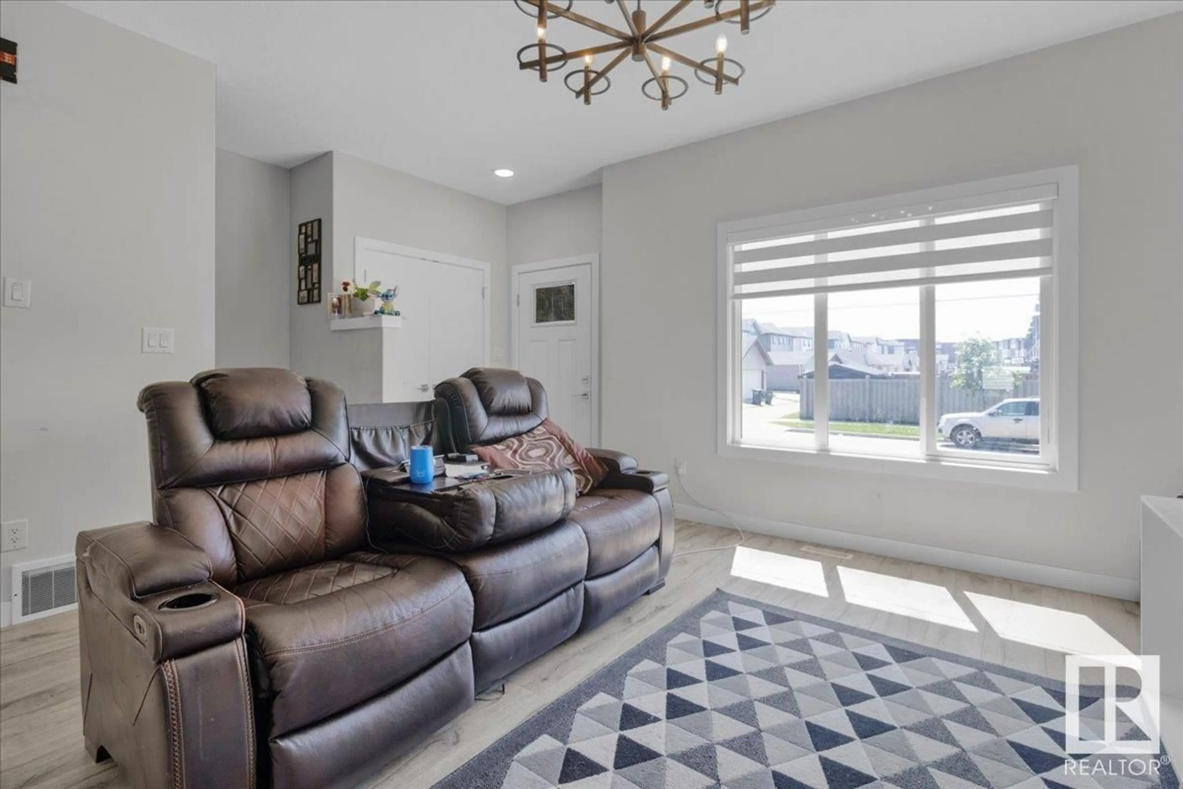 Living room with furniture, ceramic/tile floor for 9490 COLAK LN, Edmonton Alberta T6W3Y8