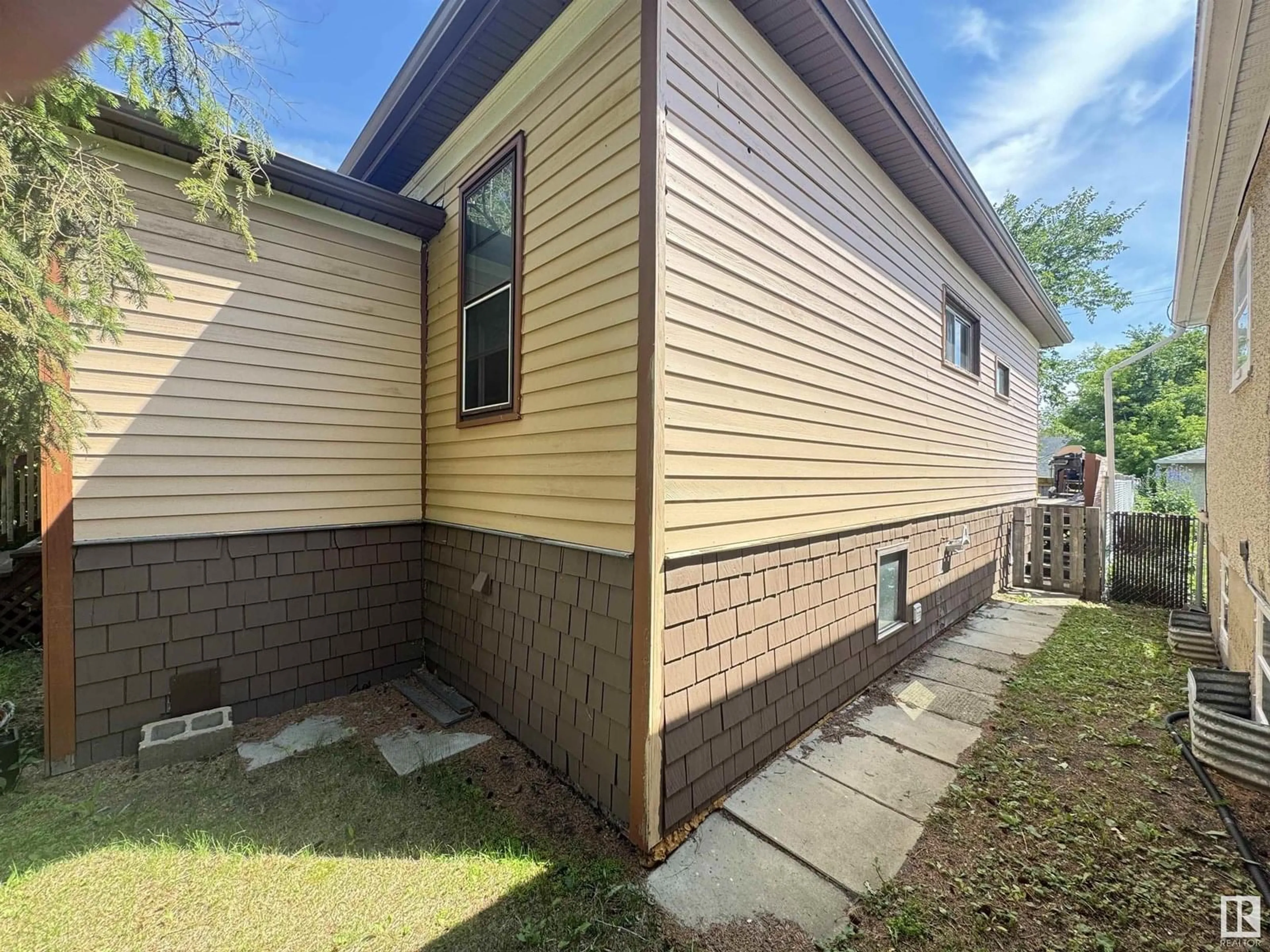 Home with vinyl exterior material, street for 10719 74 AV, Edmonton Alberta T6E1G7