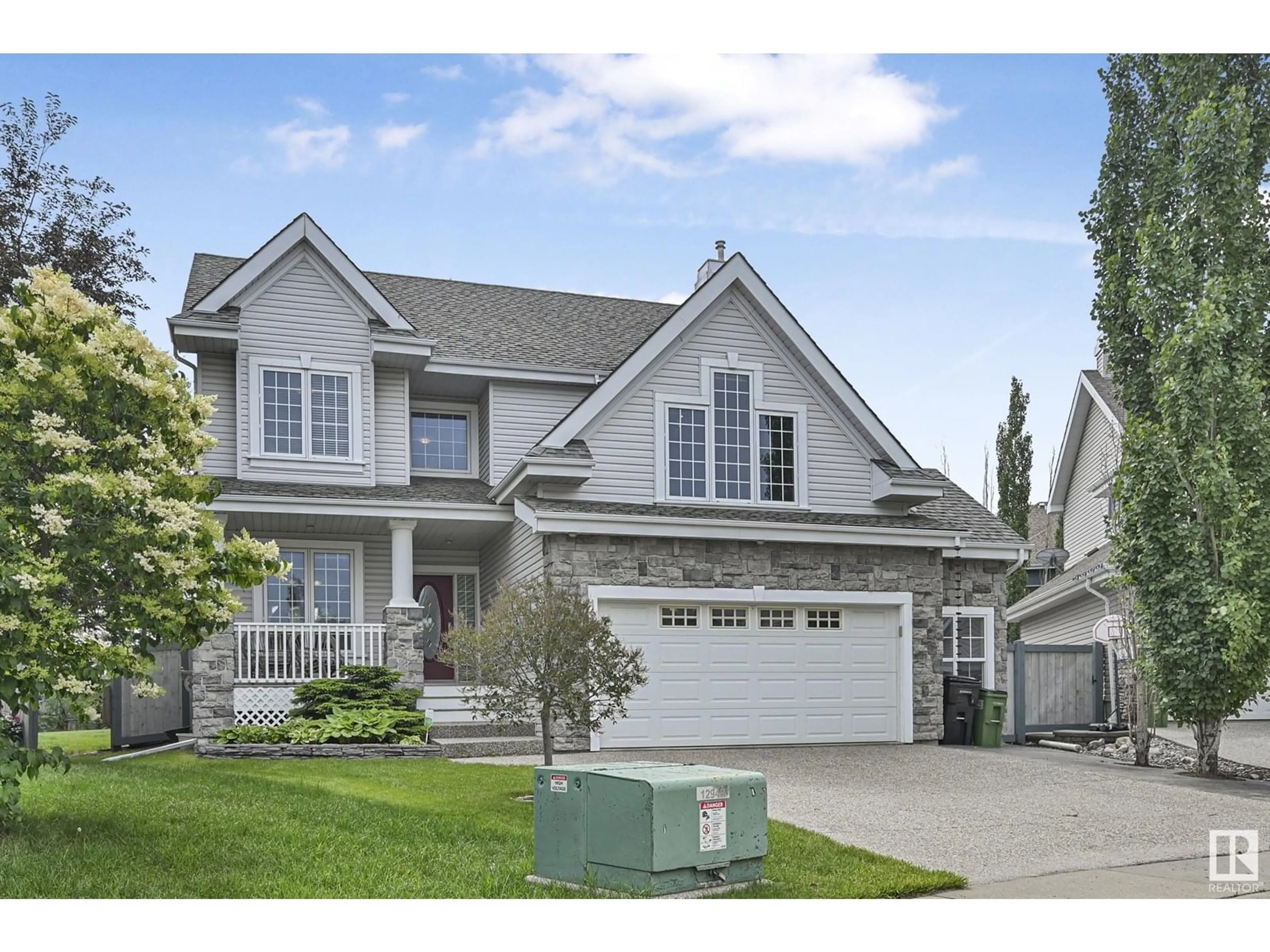 Home with vinyl exterior material, street for 1207 SUMMERSIDE DR, Edmonton Alberta T6X1C5