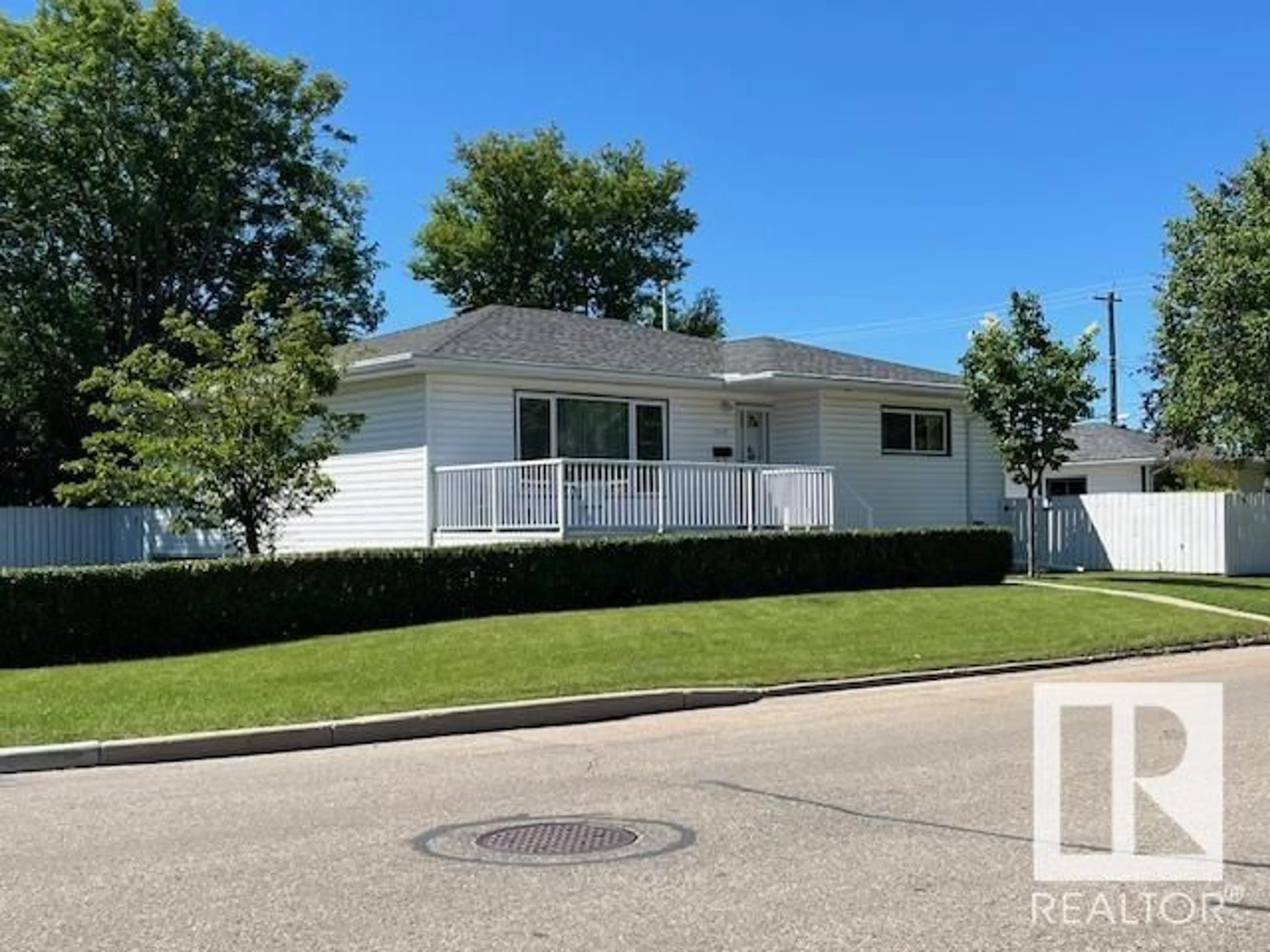 Home with vinyl exterior material, street for 15103 92 AV, Edmonton Alberta T5R5B7