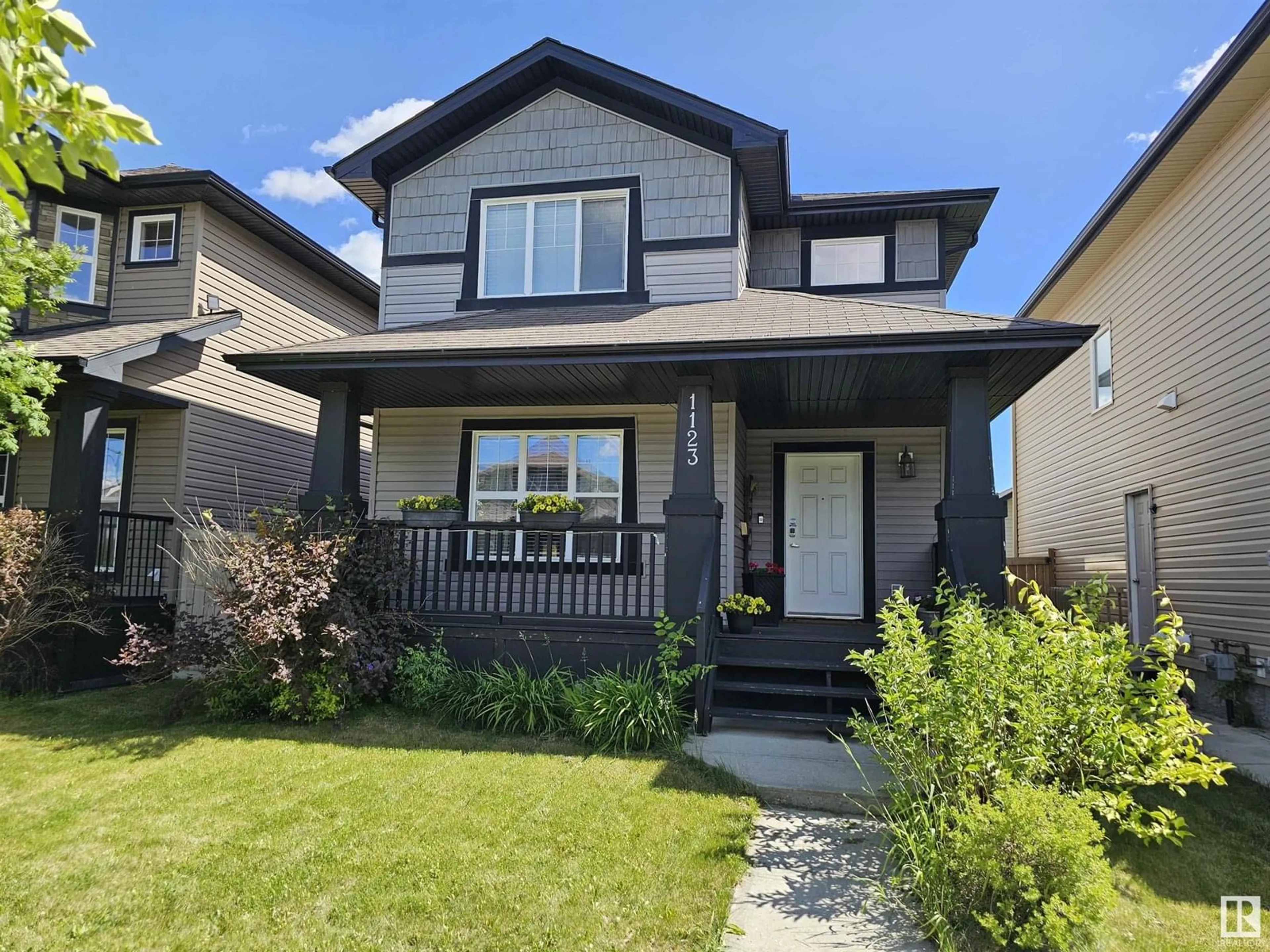 Home with vinyl exterior material, street for 1123 36 AV, Edmonton Alberta T6T0E9