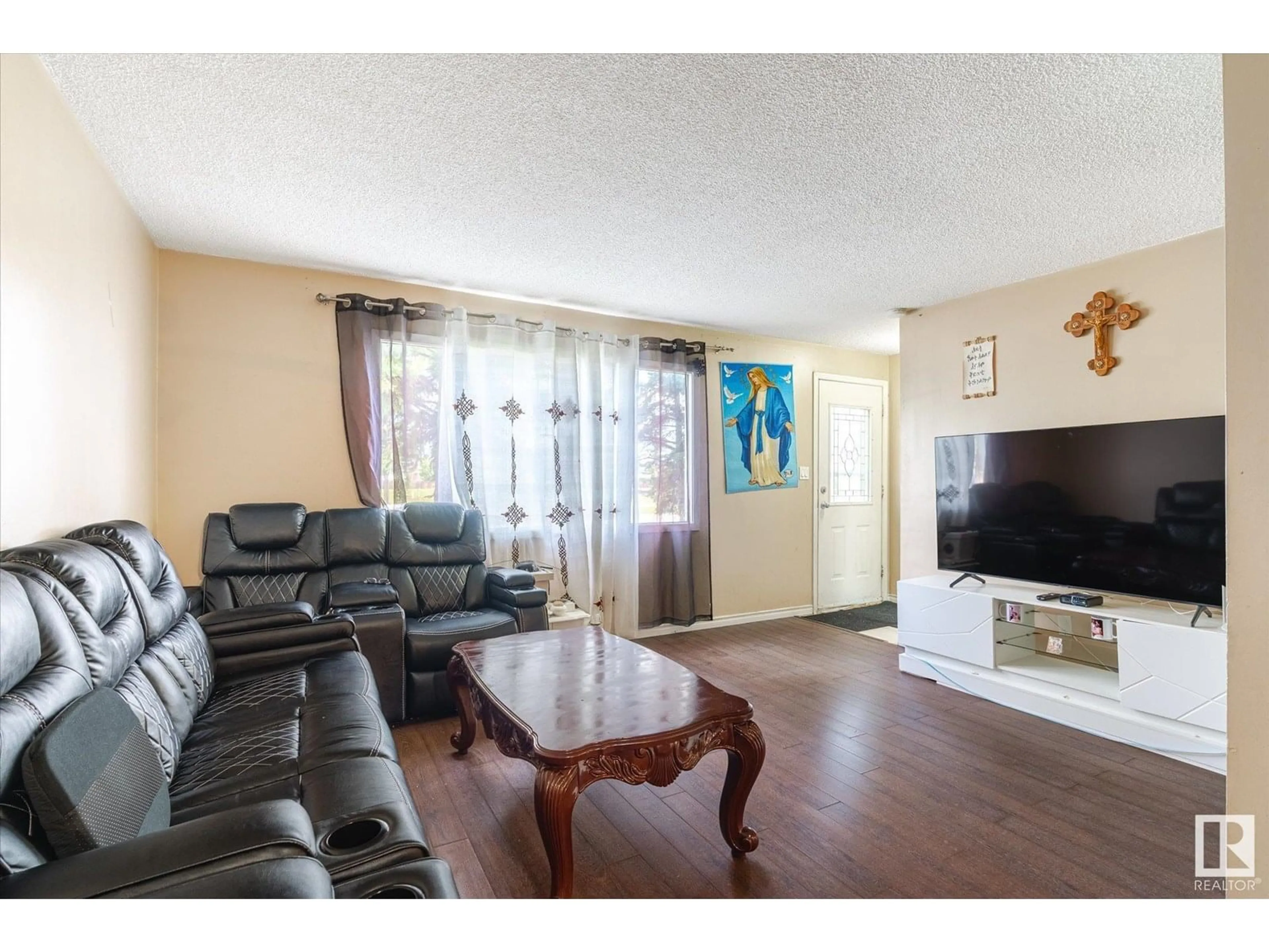 Living room with furniture, wood/laminate floor for 11607 137 AV, Edmonton Alberta T5E1Z6