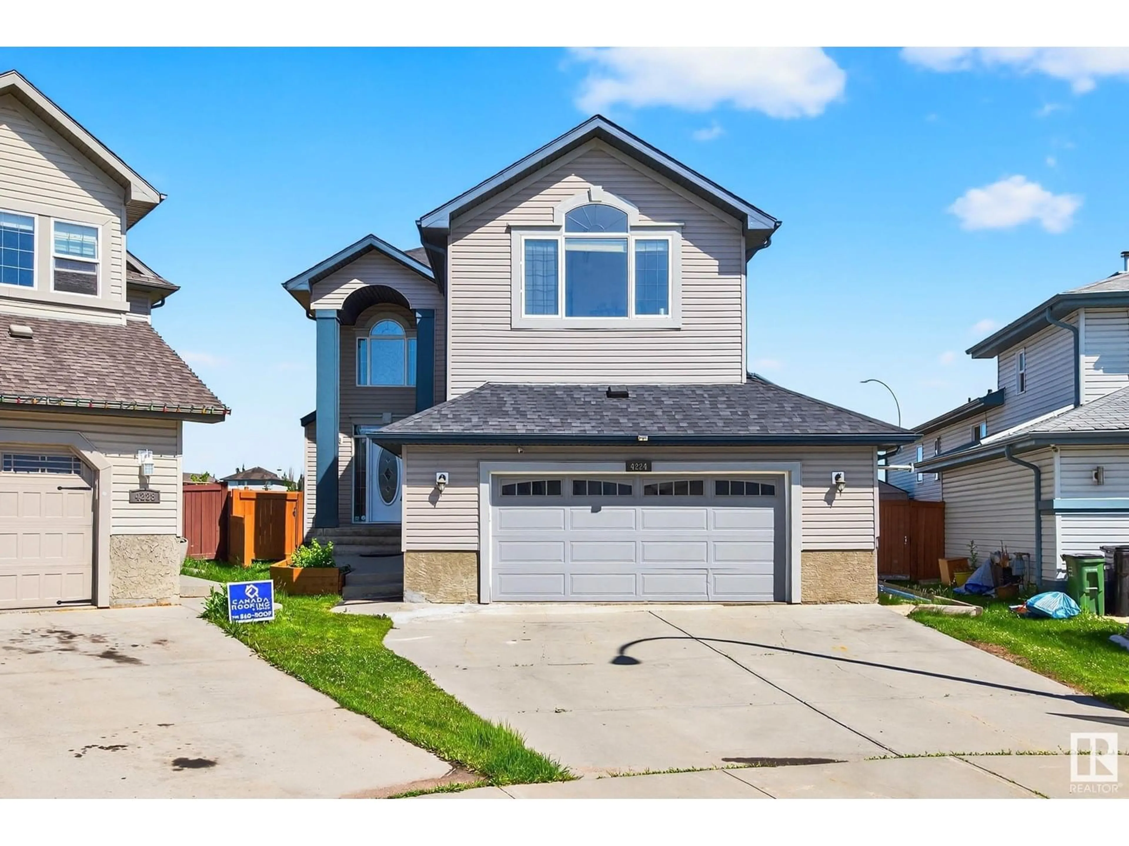 Home with vinyl exterior material, street for 4224 157 AV, Edmonton Alberta T5Y0C9