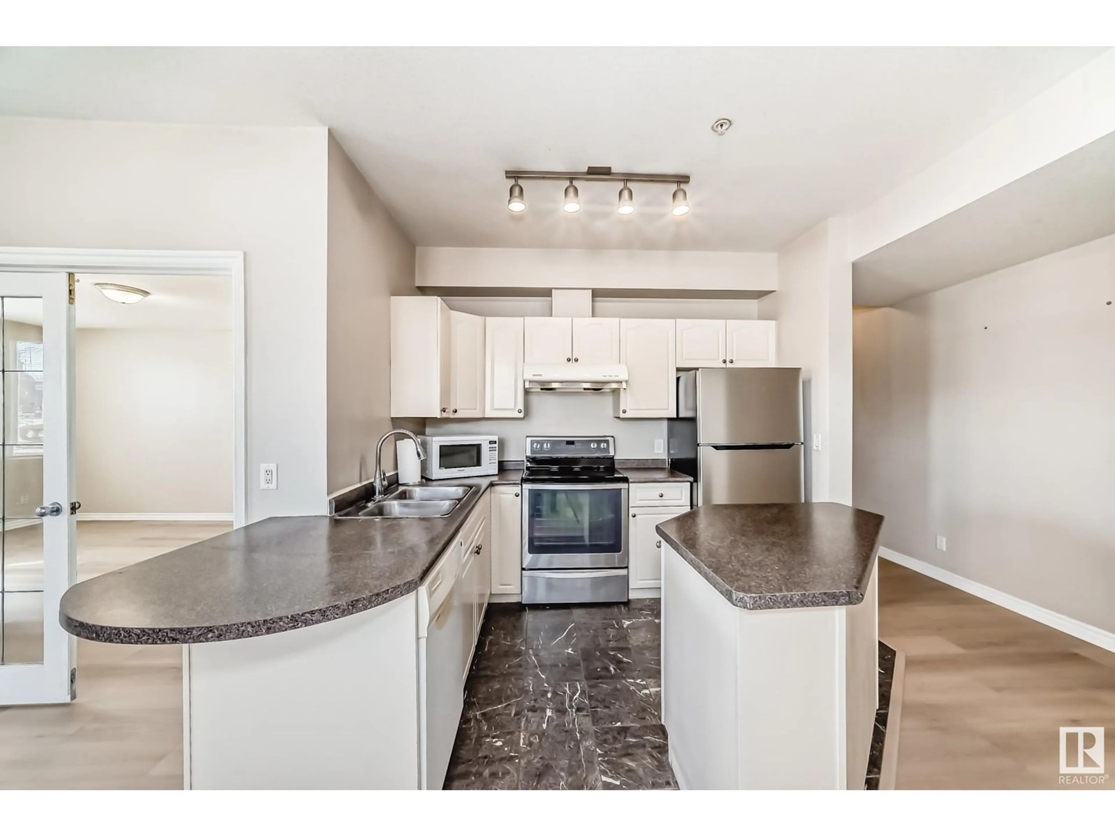 Open concept kitchen, unknown for #101 - 10346 117 ST, Edmonton Alberta T5K2Y7